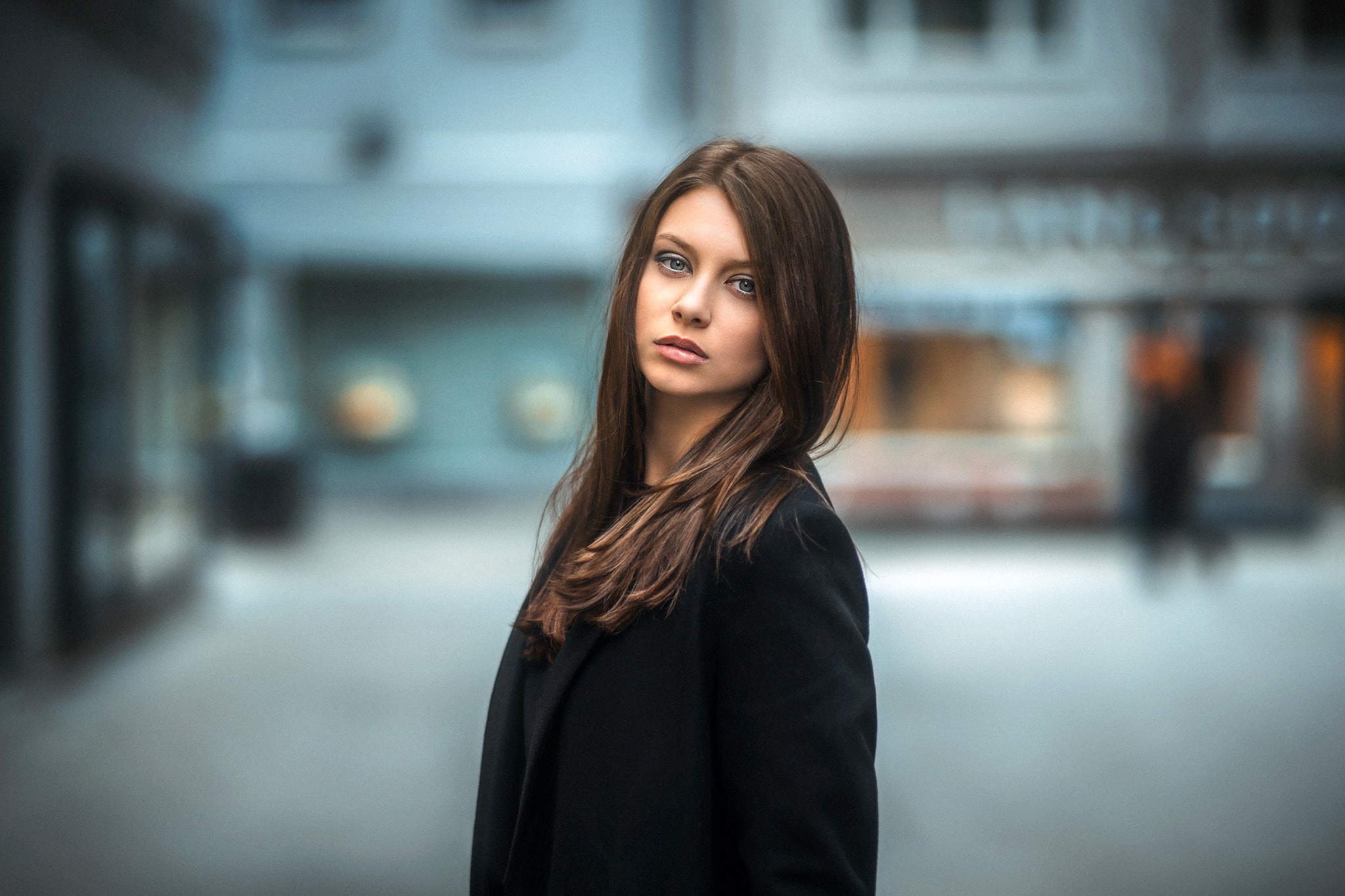Woman with long brown hair wearing a black coat HD Wallpaper