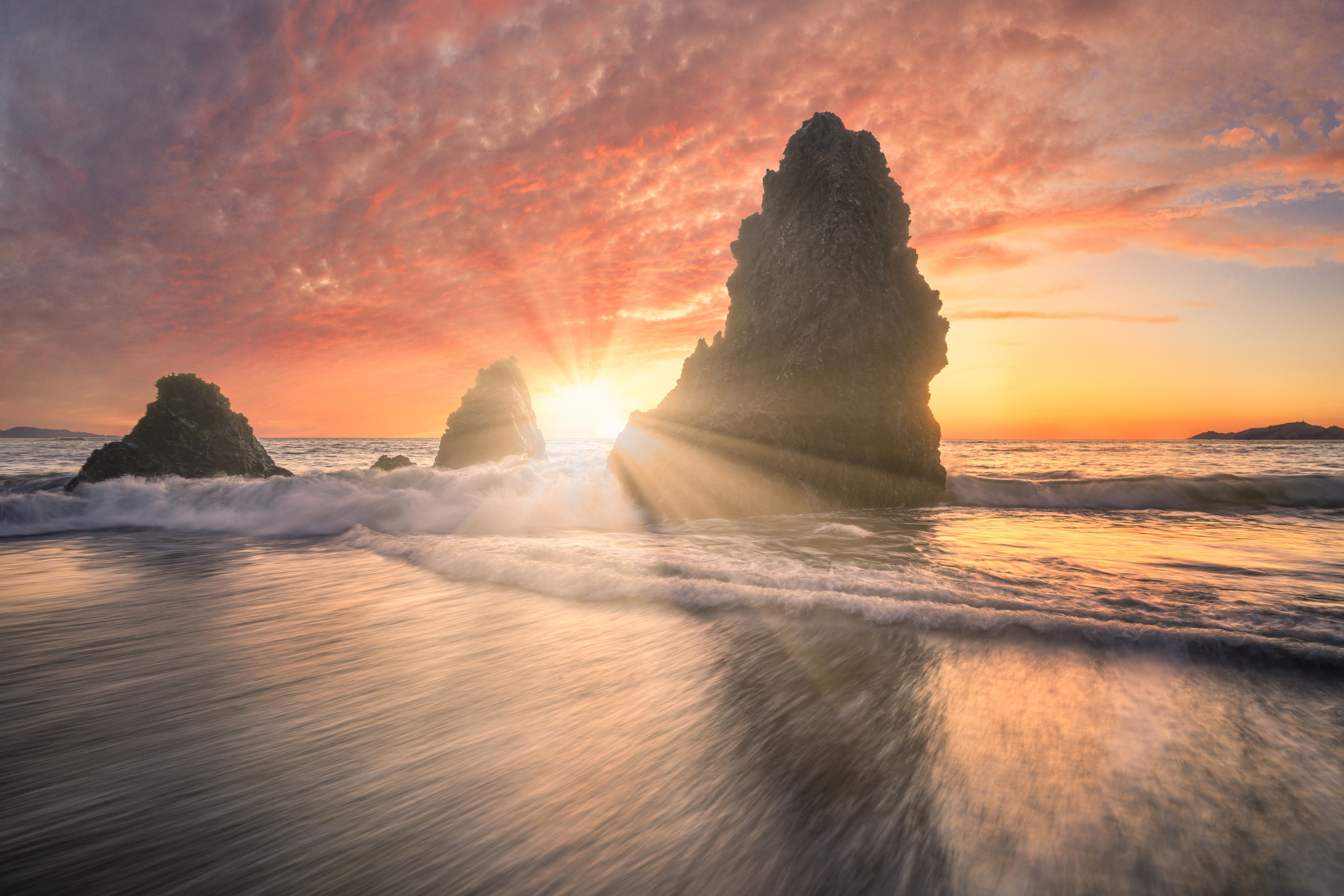 Sunrise over ocean with rock formations HD Wallpaper