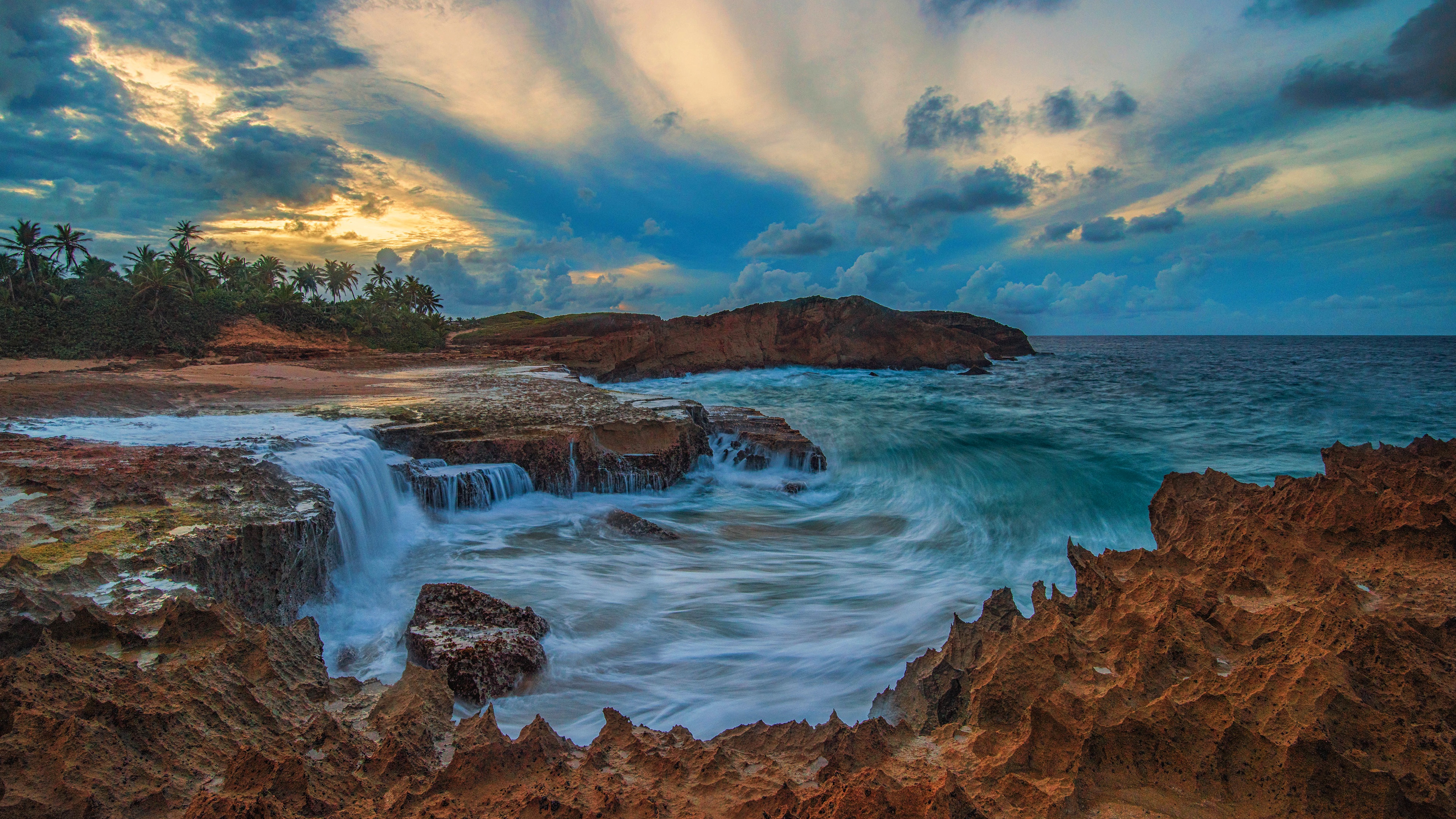 Coastline with waterfall and dramatic clouds HD Wallpaper