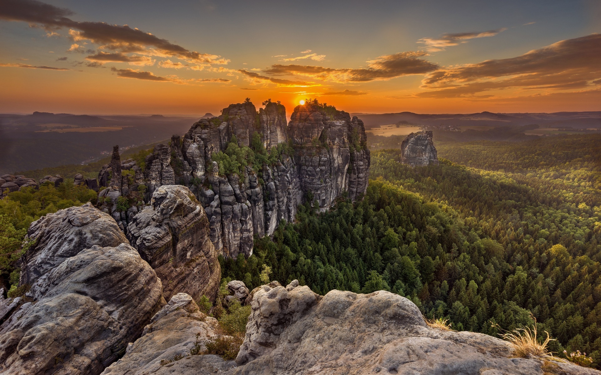 Sunset over rocky peaks and forest HD Wallpaper