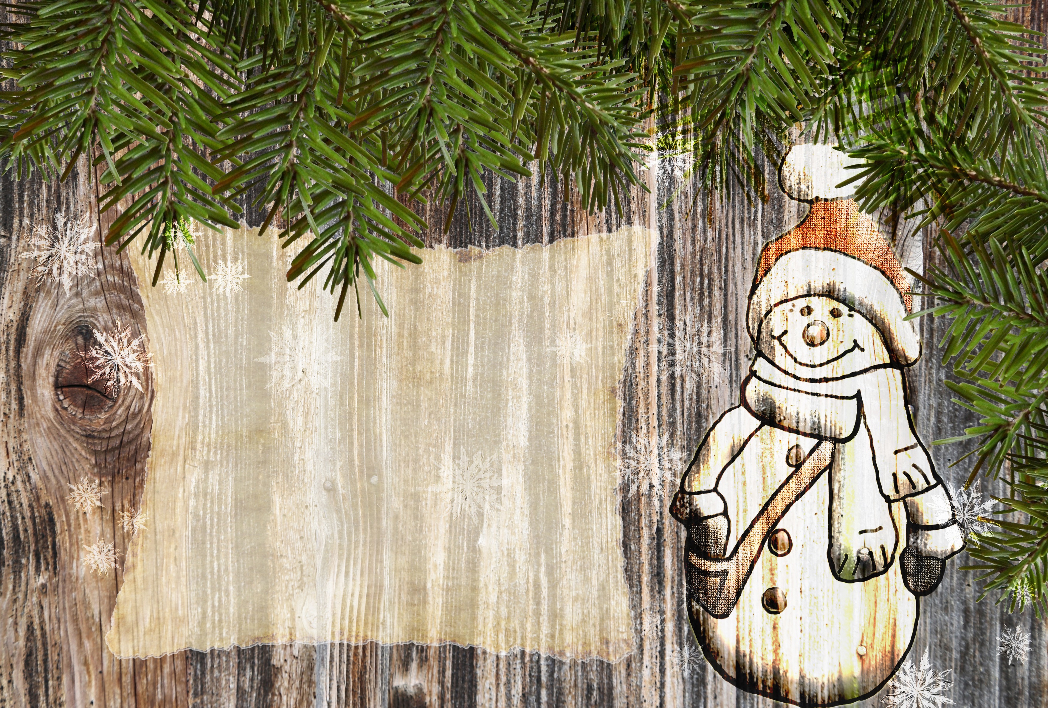 Christmas snowman on wooden background with pine branches HD Wallpaper