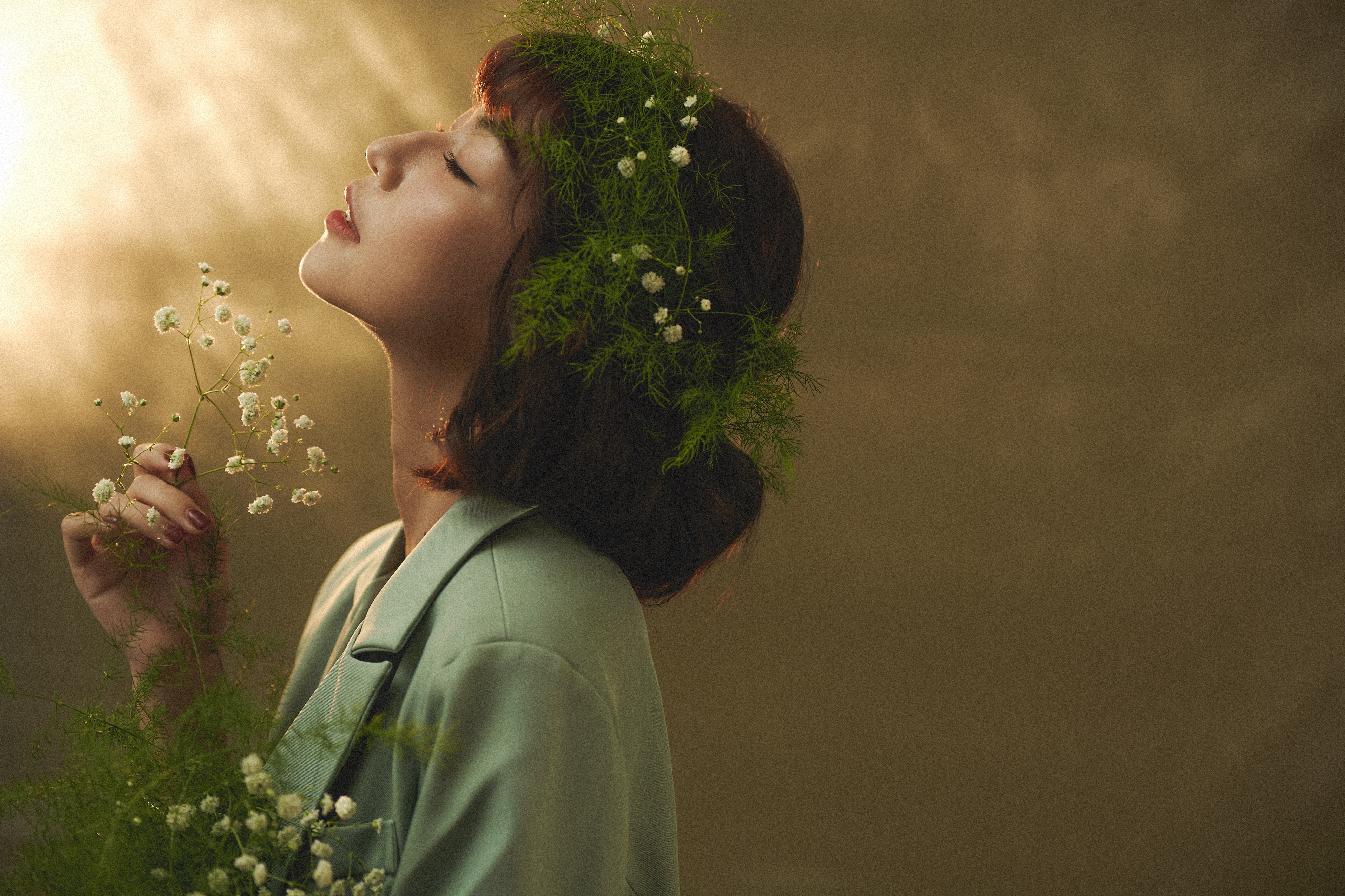 Woman with flowers in hair and jacket HD Wallpaper
