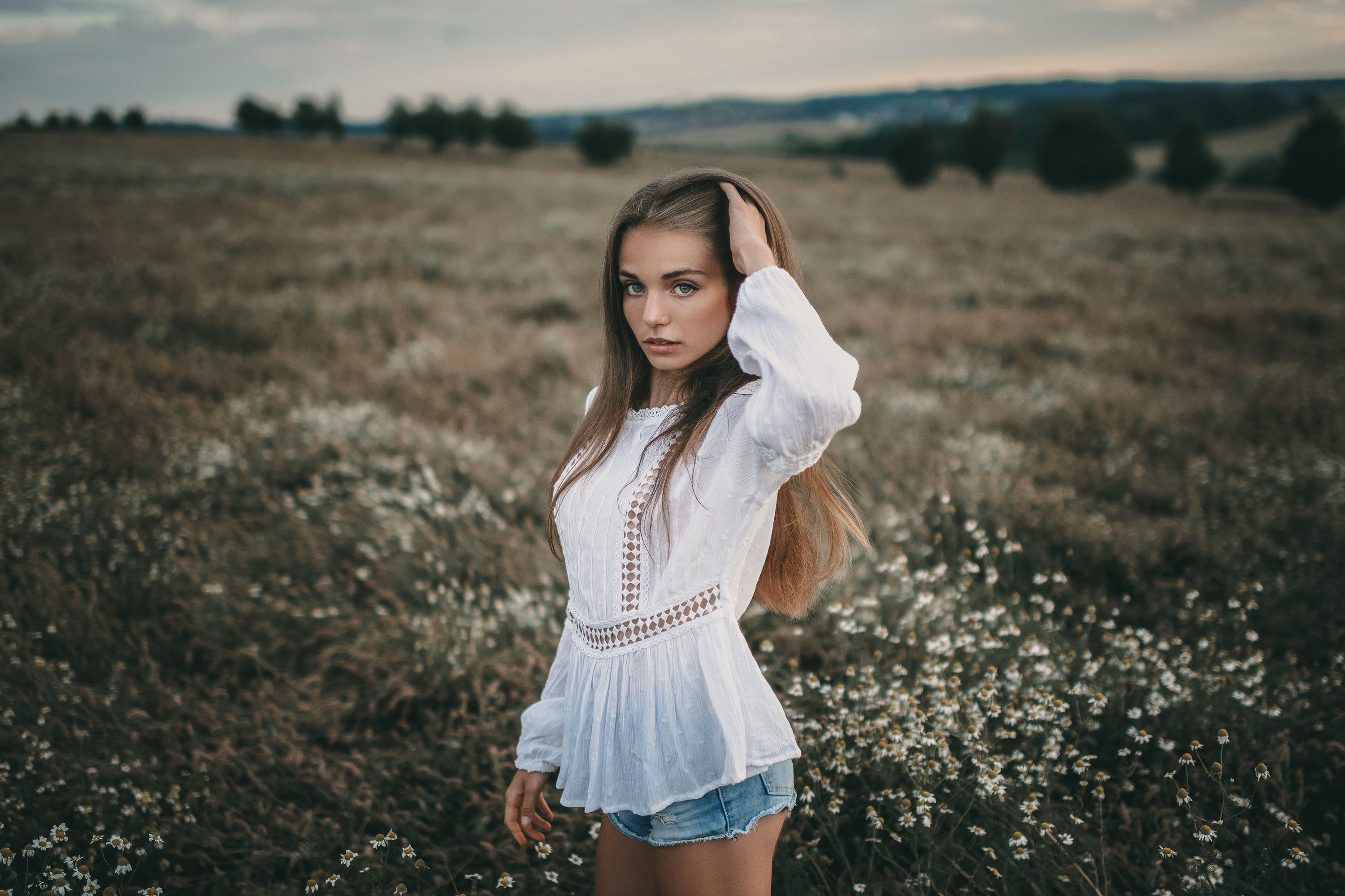 Woman with long hair in a field HD Wallpaper