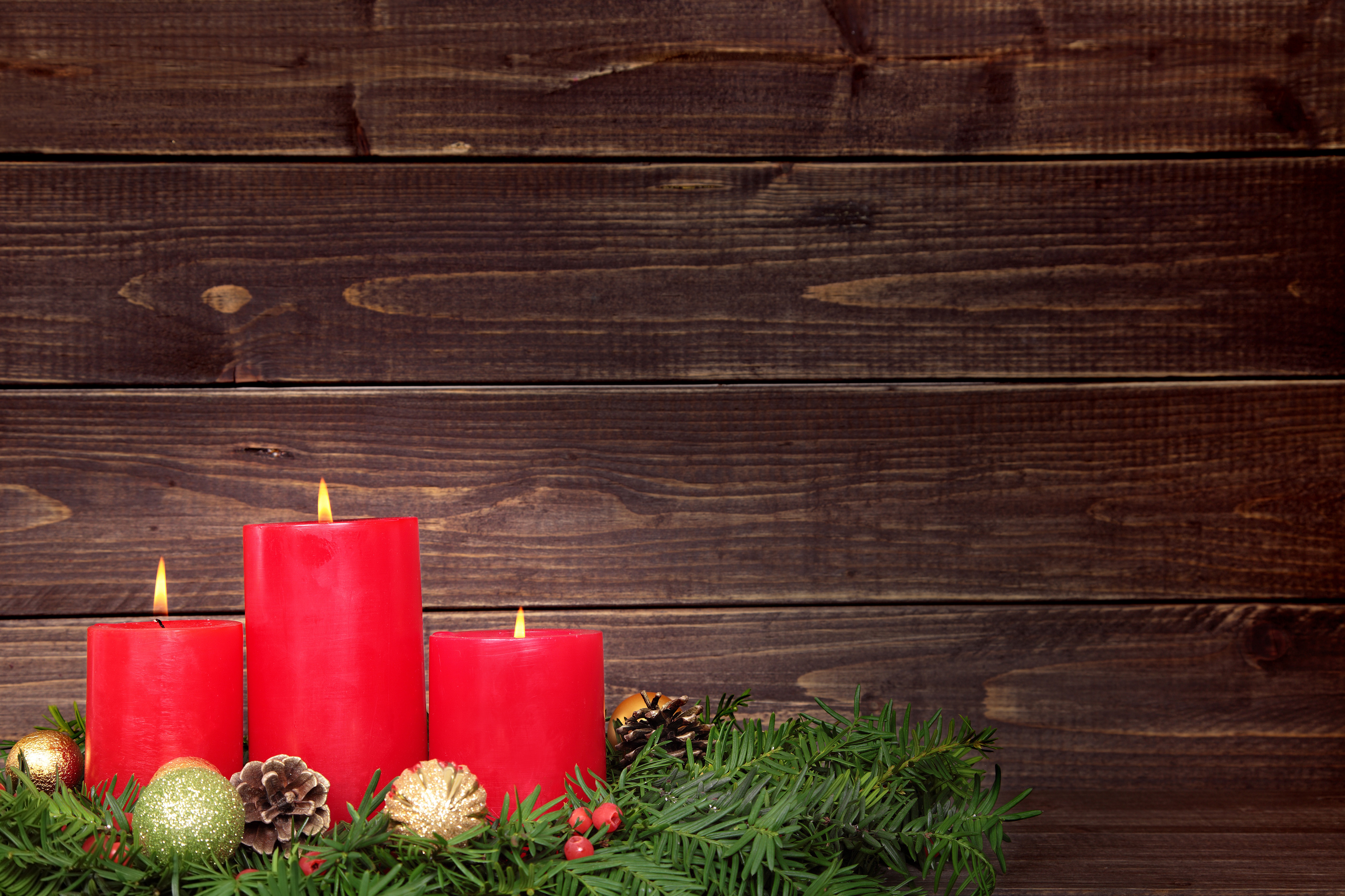 Christmas candles with ornaments on wooden background 4K HD Wallpaper