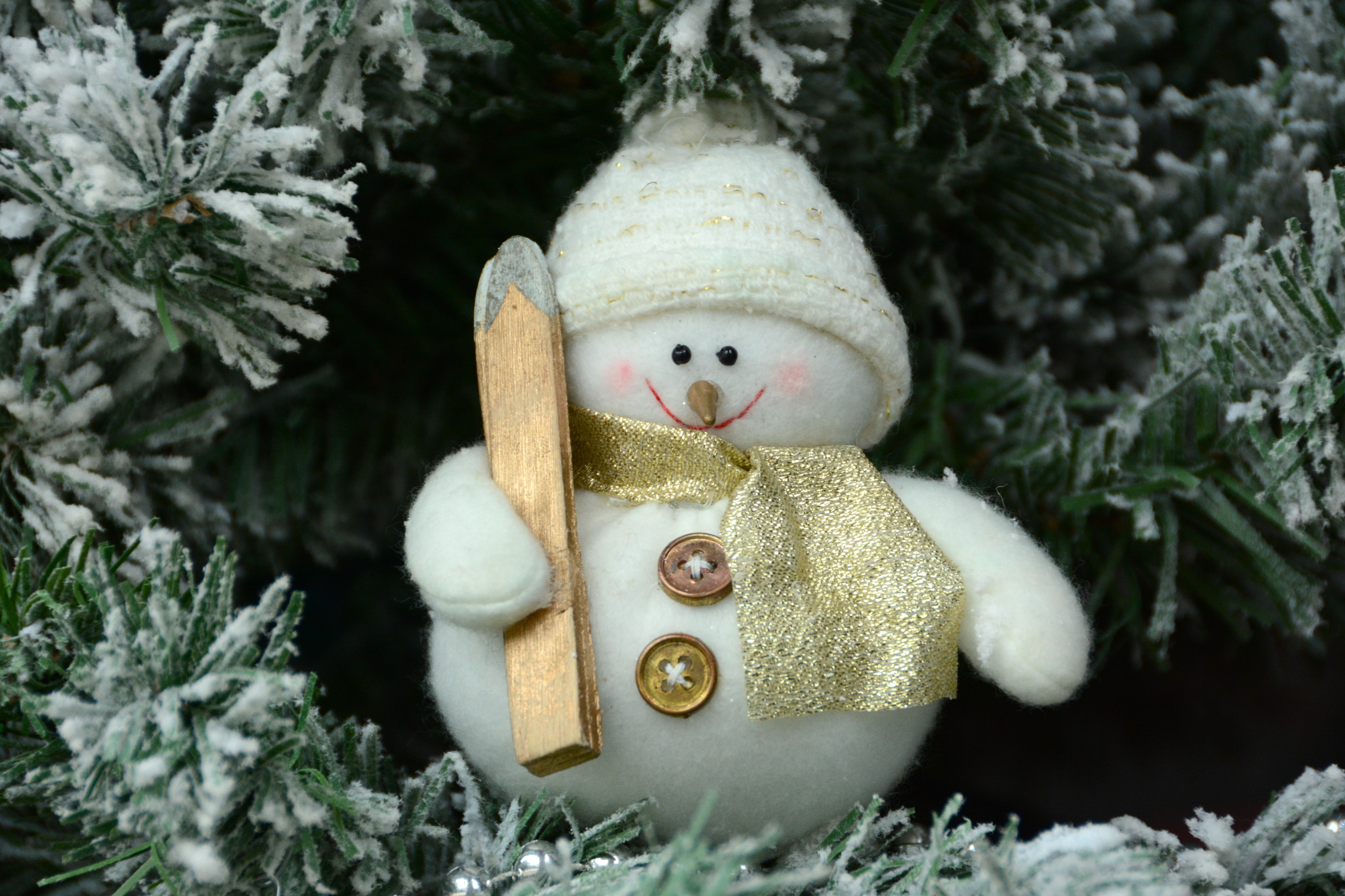Snowman toy with ski on Christmas tree HD Wallpaper