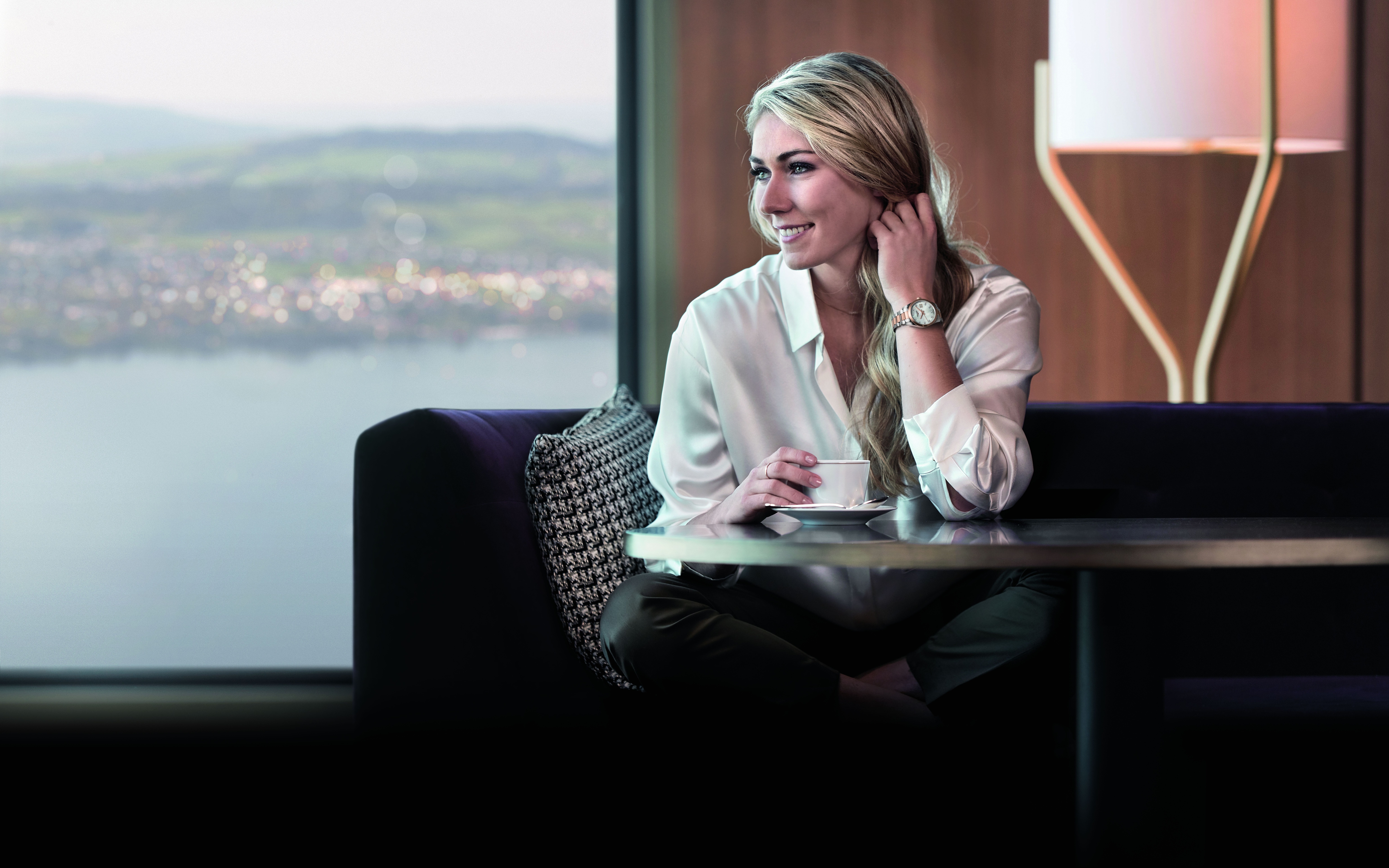 Mikaela Shiffrin sitting by a window with coffee HD Wallpaper