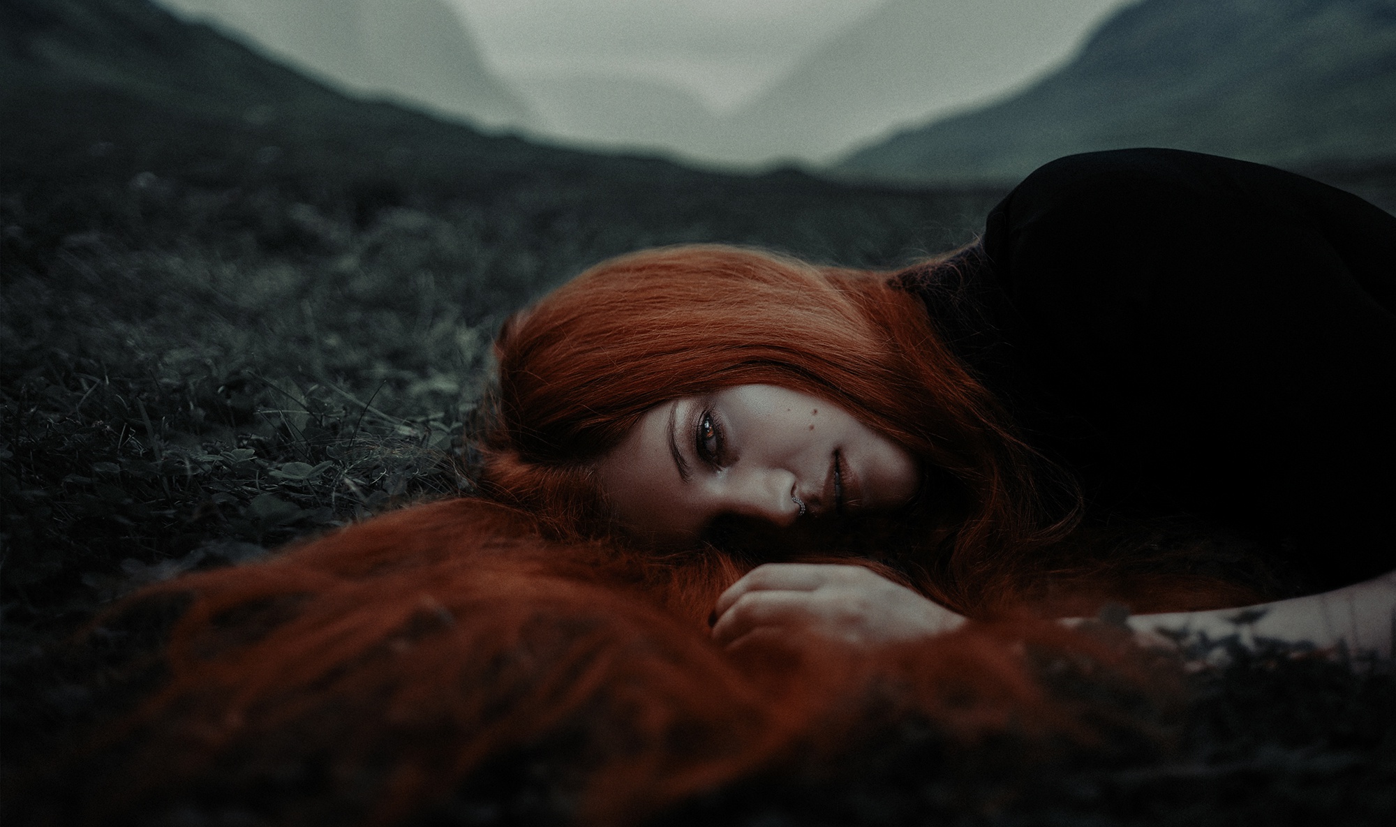 Woman with red hair lying down in nature HD Wallpaper