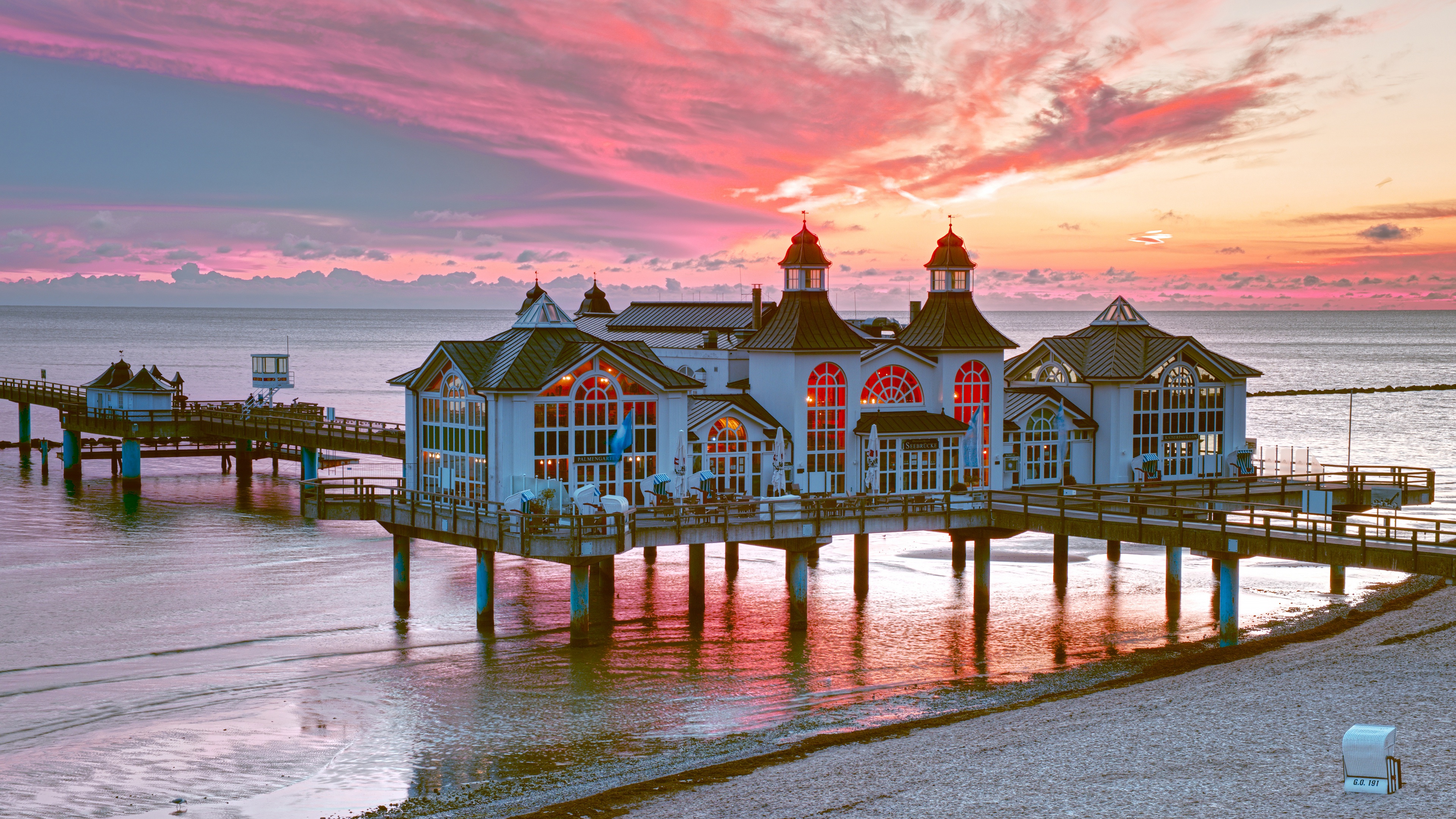 Pier building on the sea during sunset HD Wallpaper
