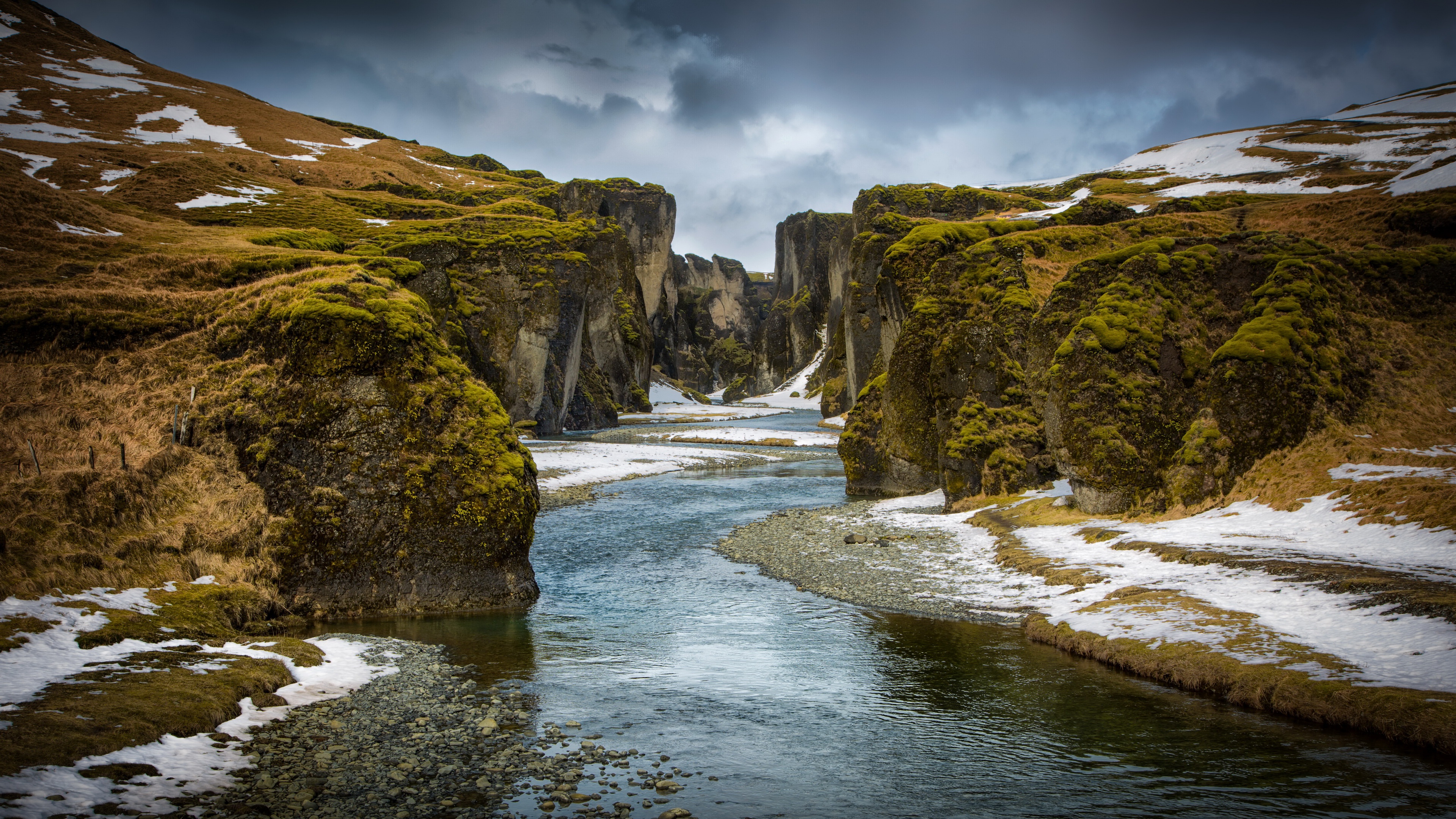River canyon with snow and mossy rocks HD Wallpaper