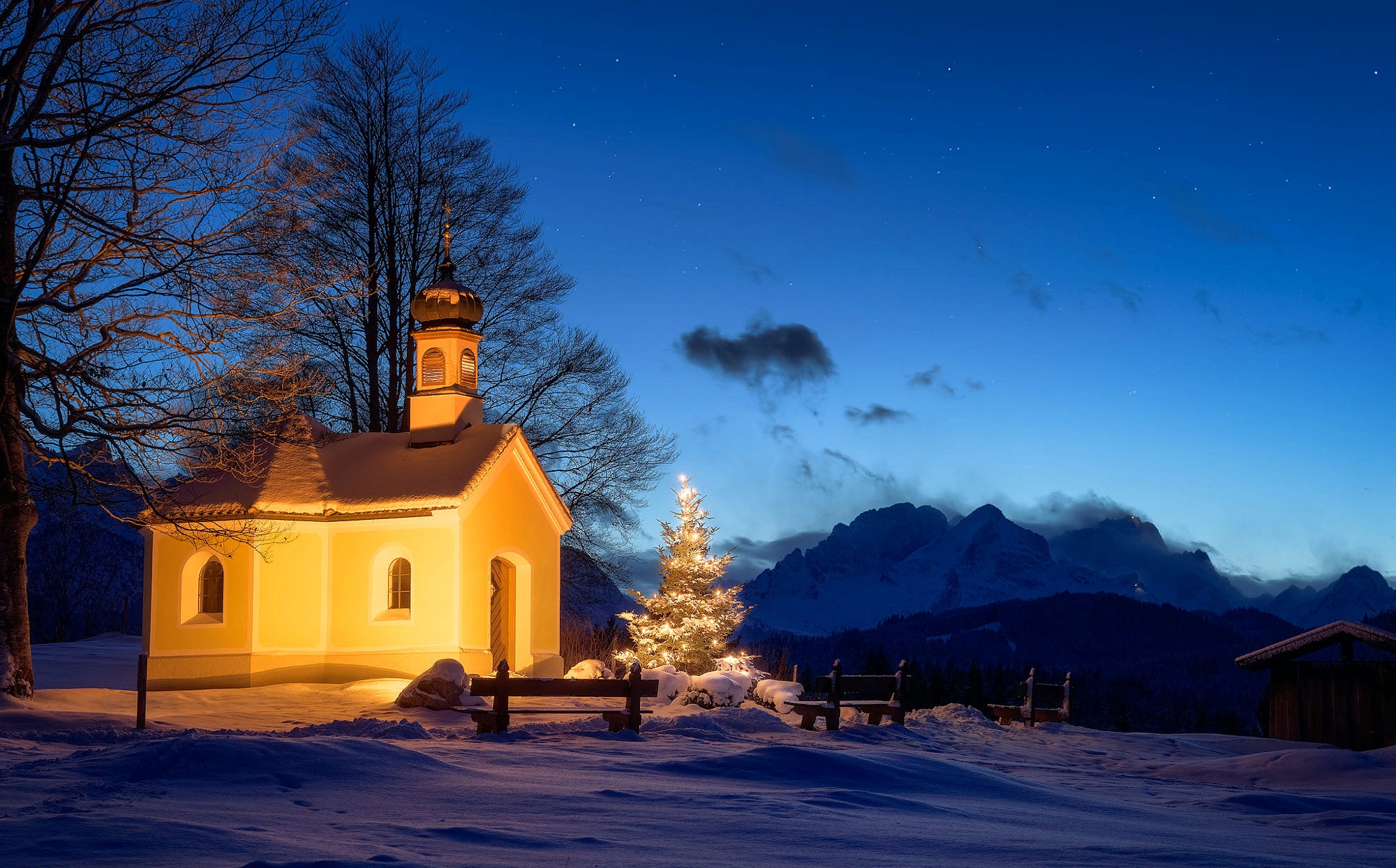 Chapel in the snow at night with Christmas tree HD Wallpaper