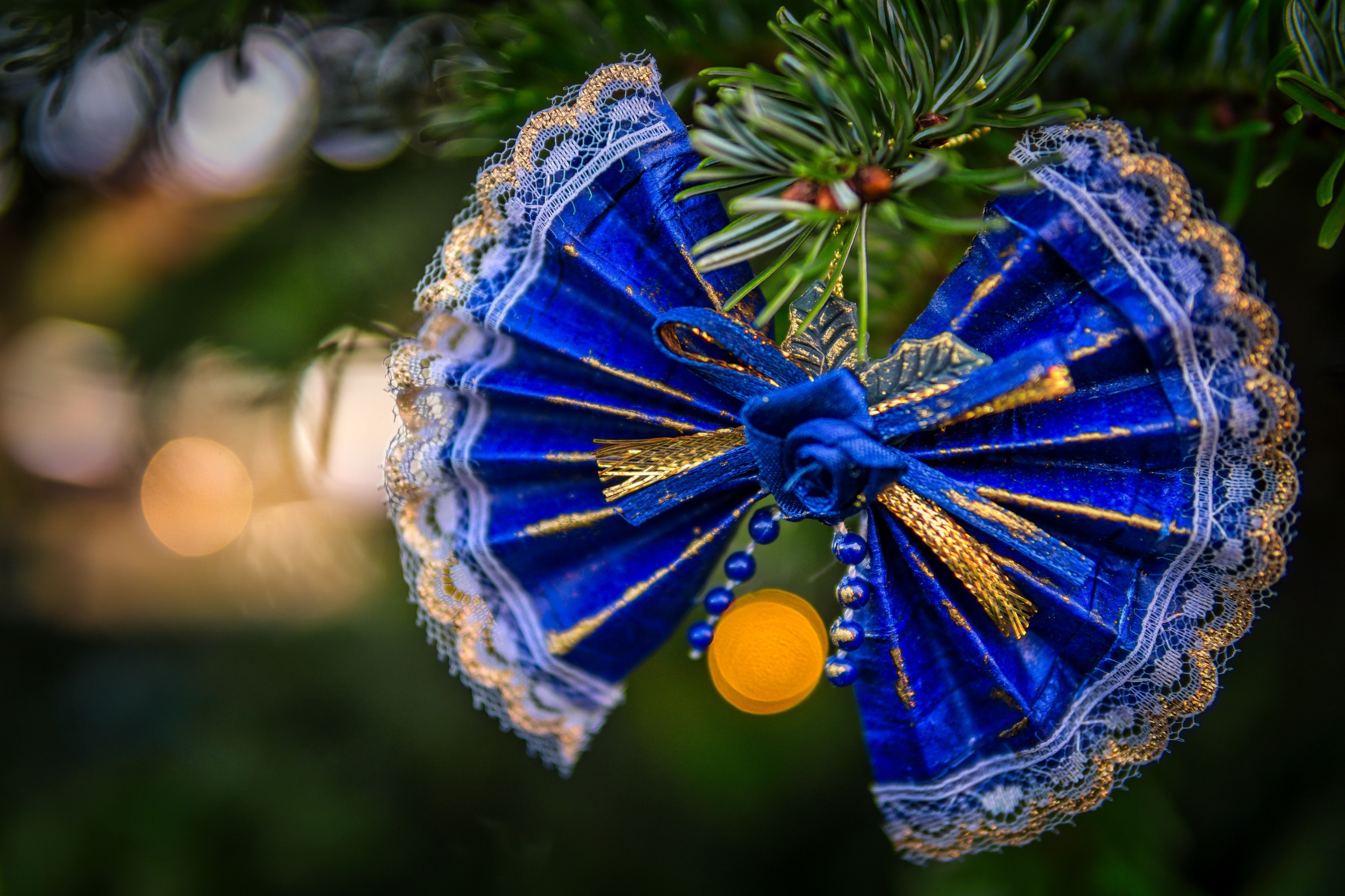 Blue and gold Christmas ornament on a tree HD Wallpaper