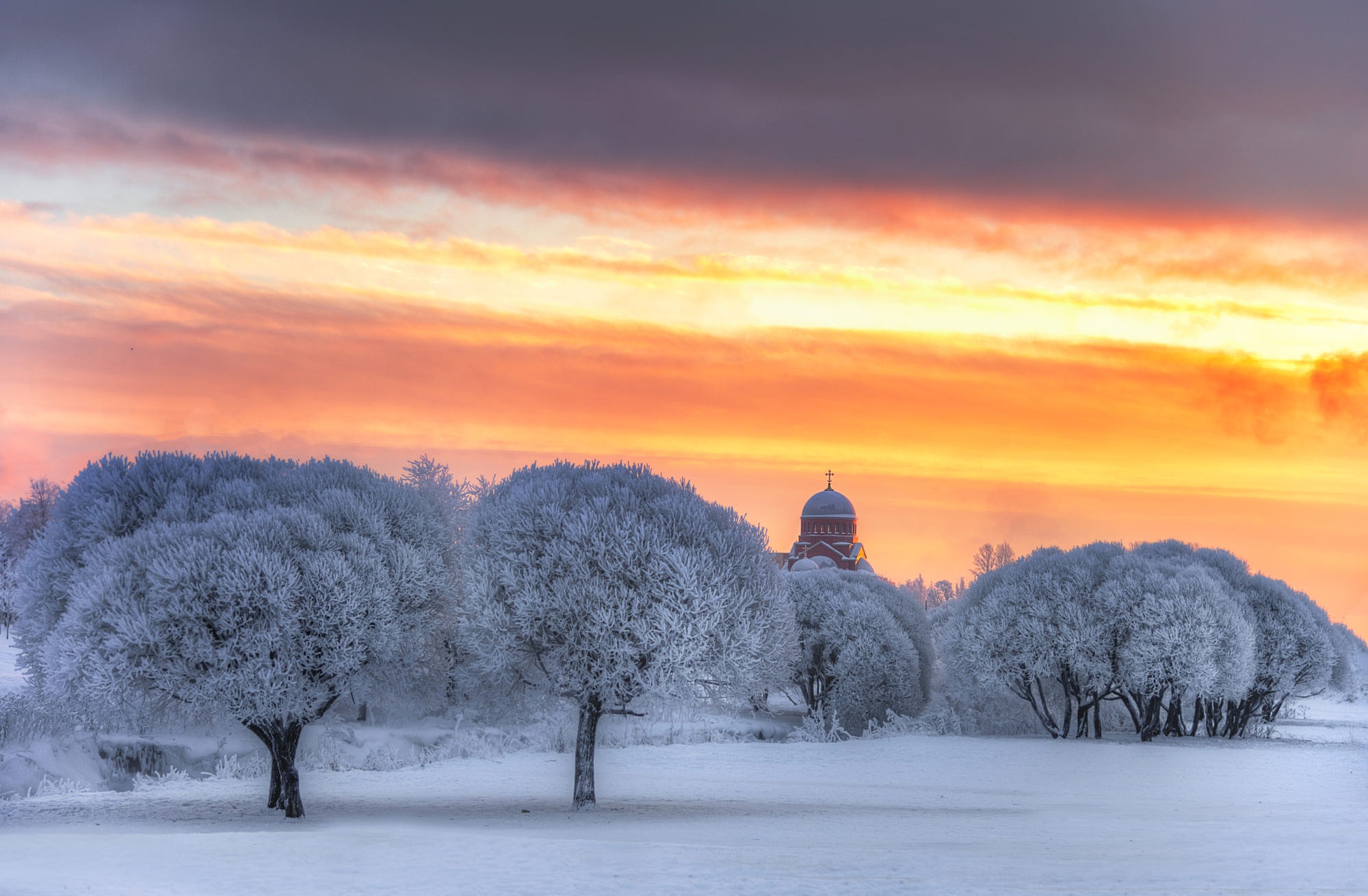 Church in winter landscape at sunset HD Wallpaper