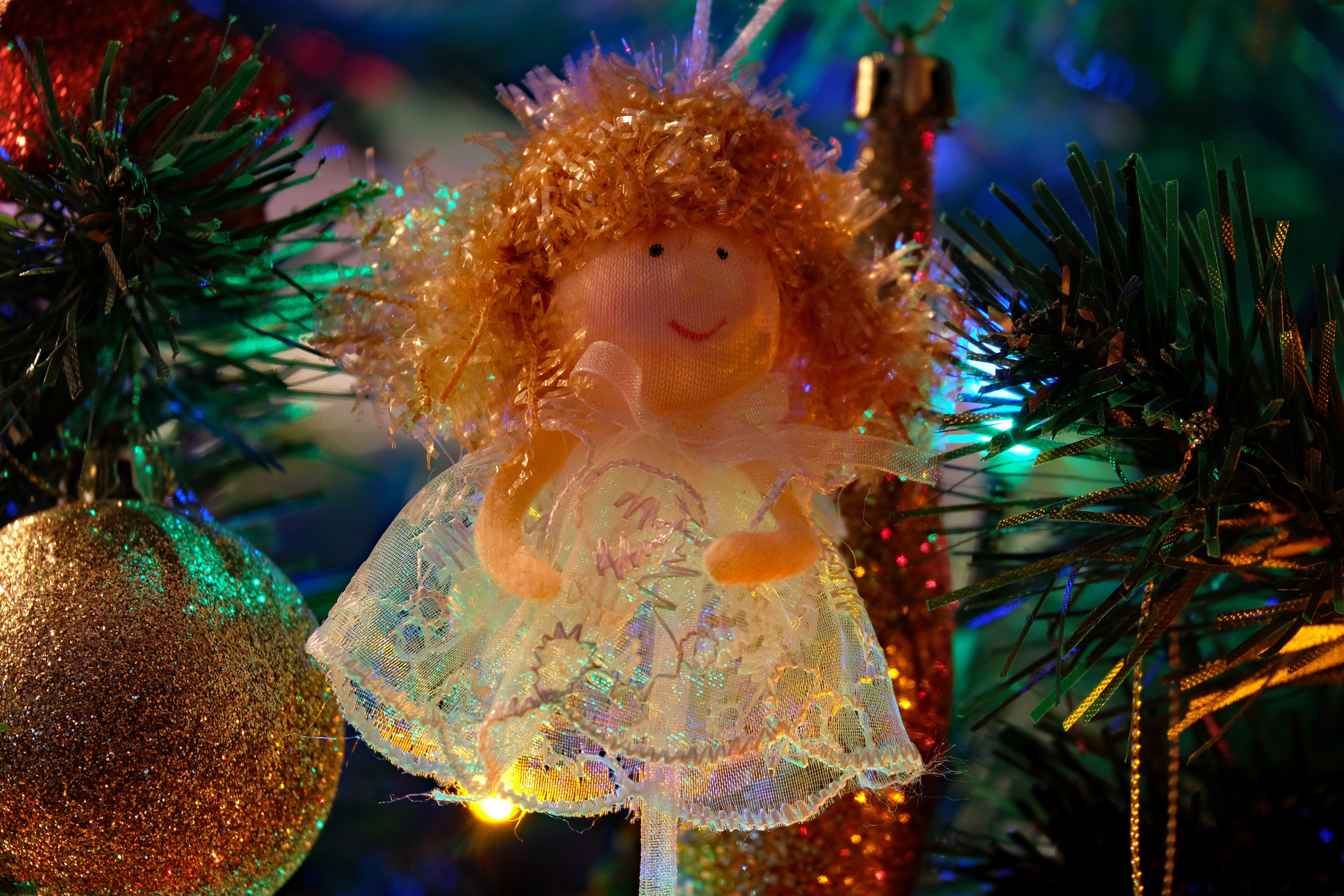 Christmas angel ornament on a tree HD Wallpaper