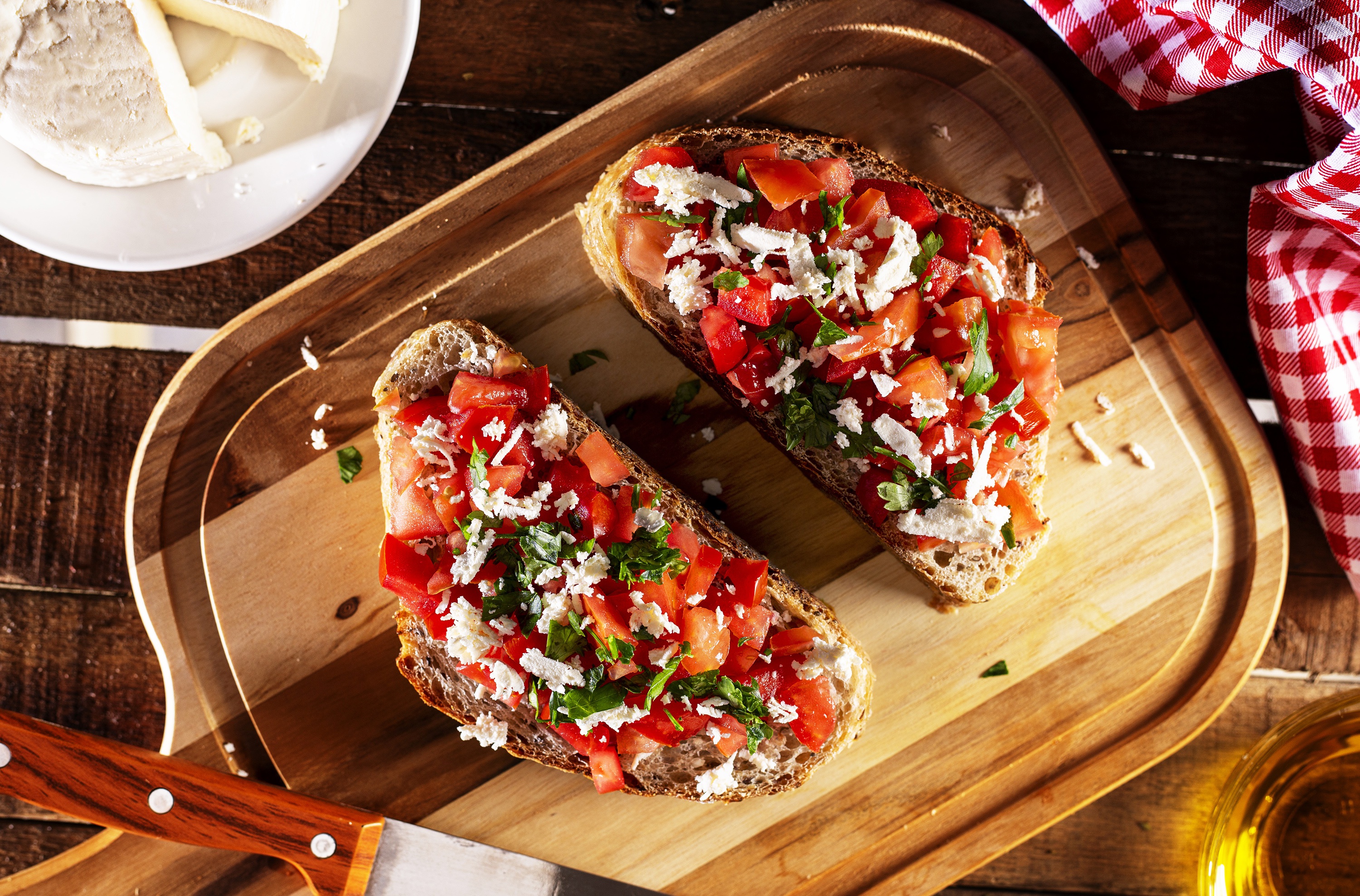 Bruschetta with tomatoes and cheese on a wooden board HD Wallpaper