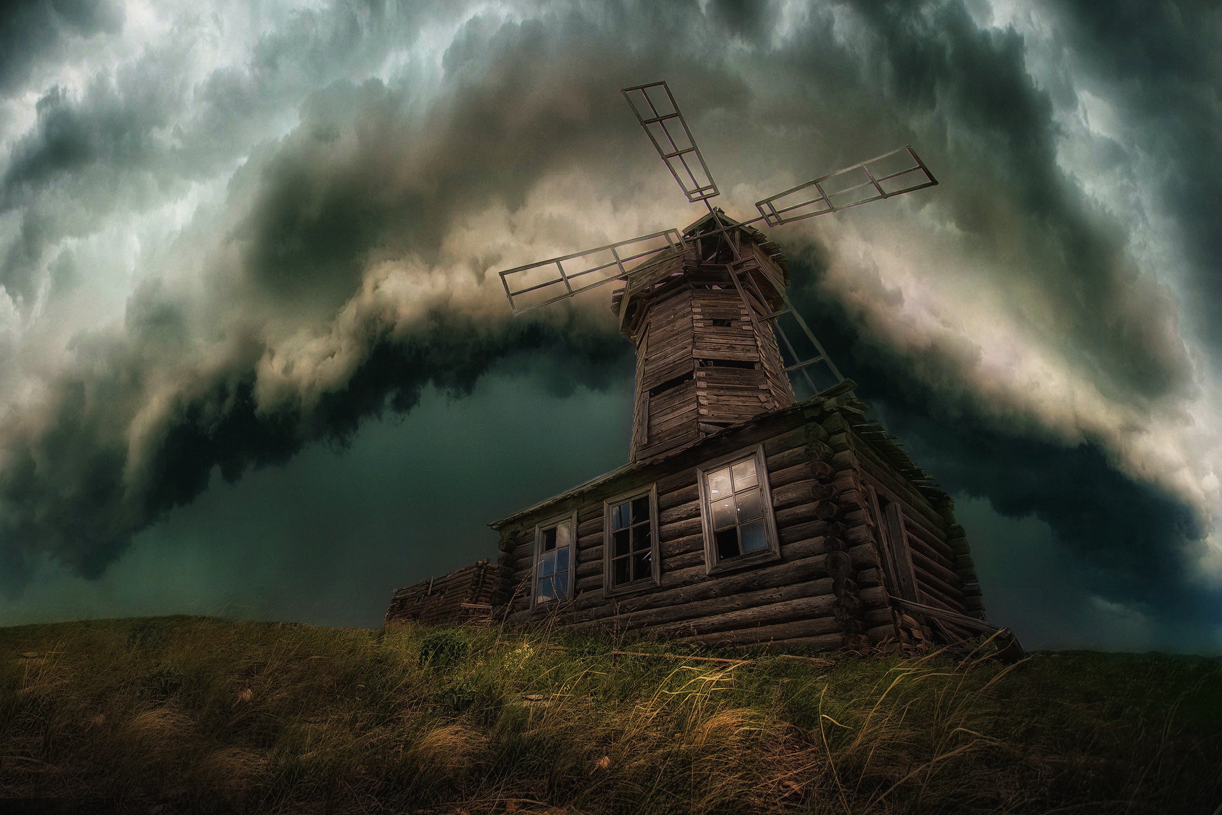 Old wooden windmill under stormy clouds HD Wallpaper
