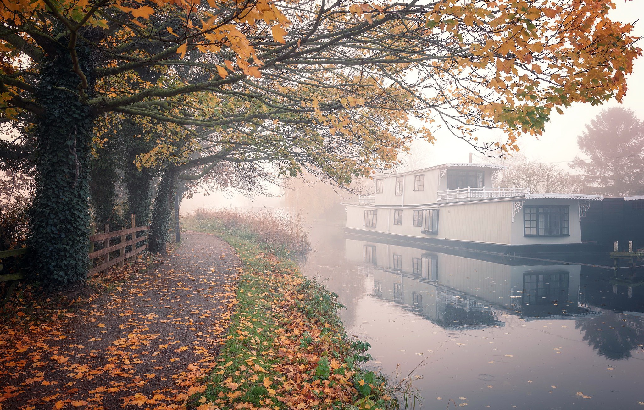 Canal with houseboat and autumn trees HD Wallpaper