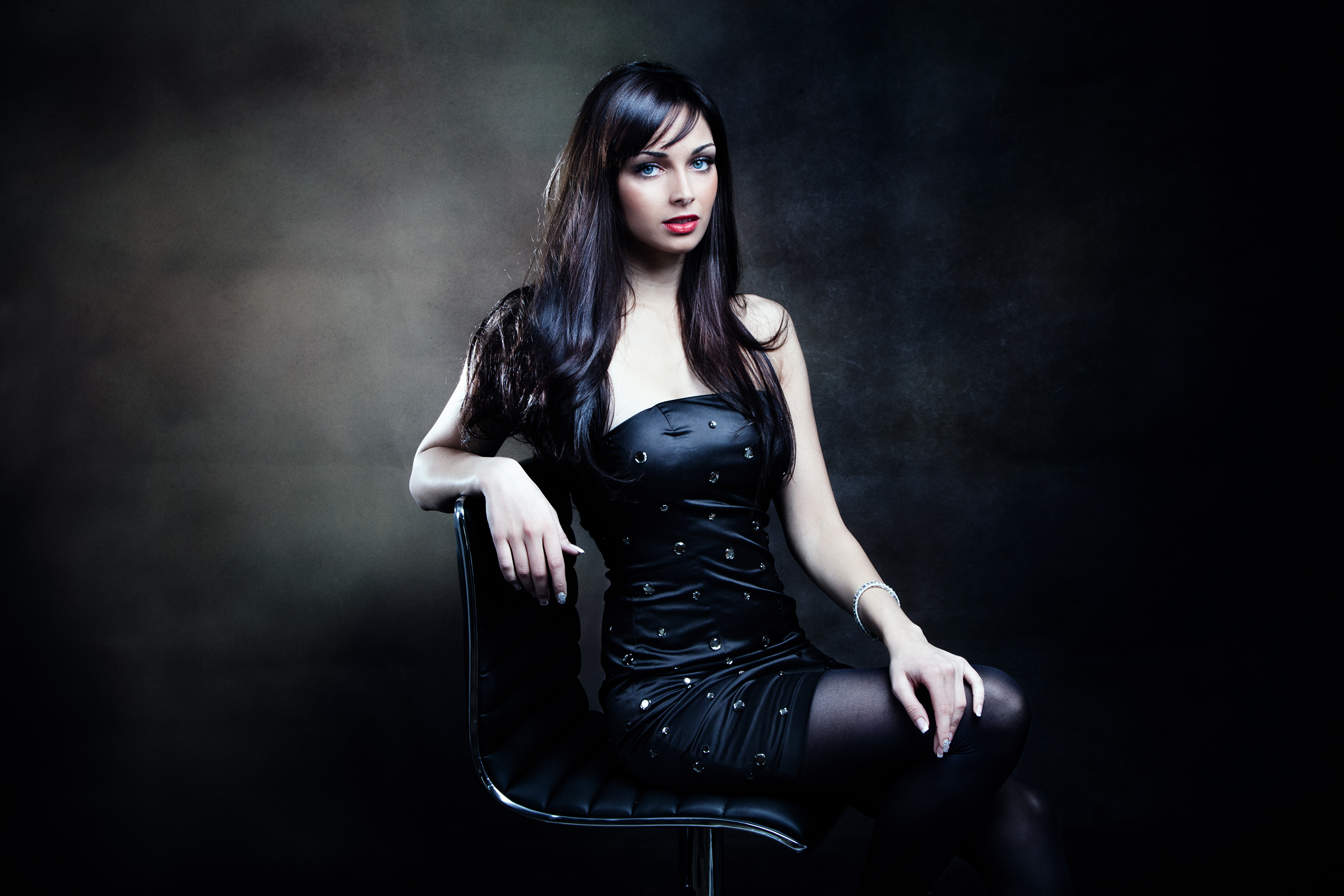 Woman with black hair and blue eyes in black dress 4K HD Wallpaper