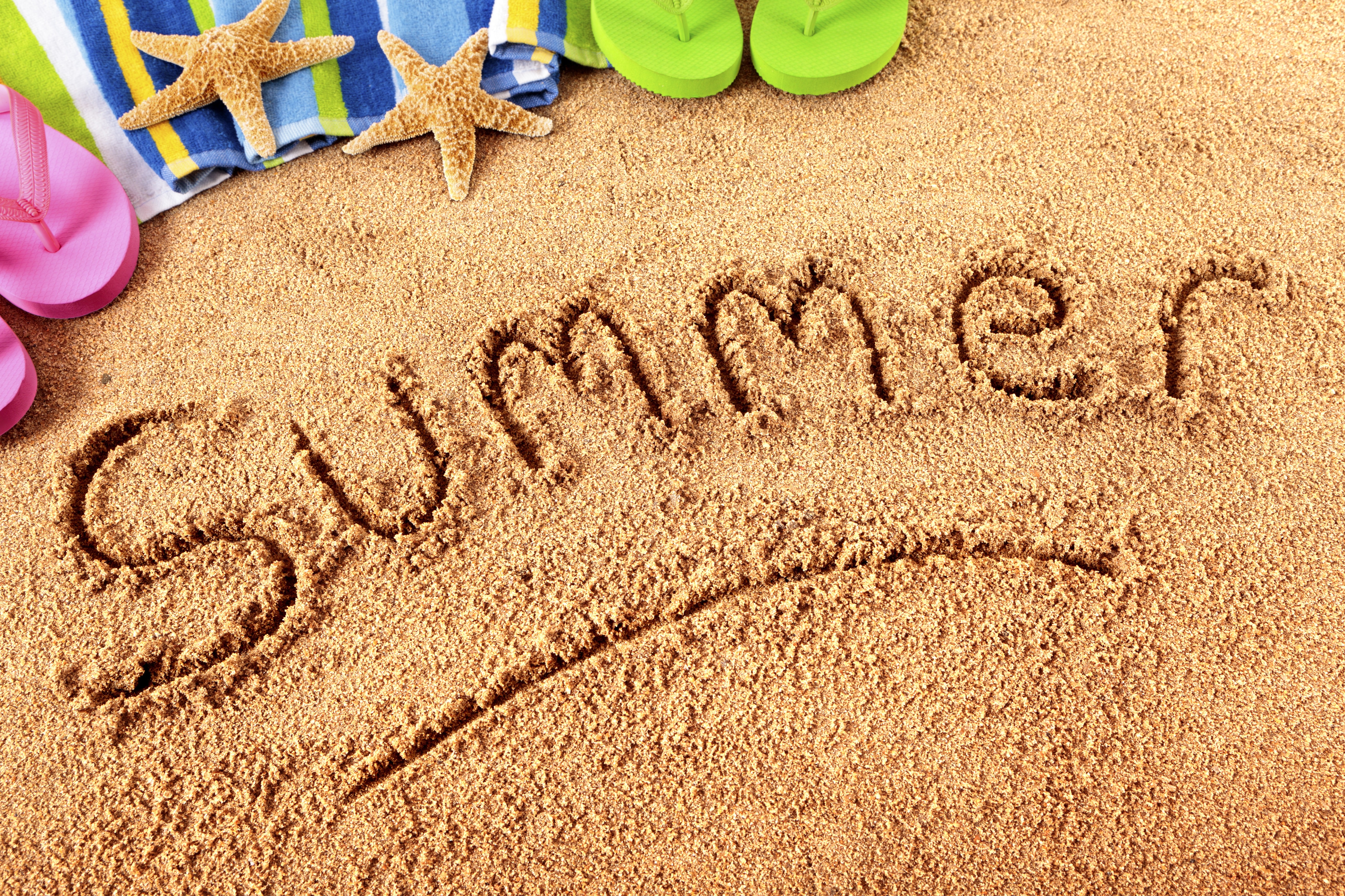 Summer written in sand with beach accessories HD Wallpaper
