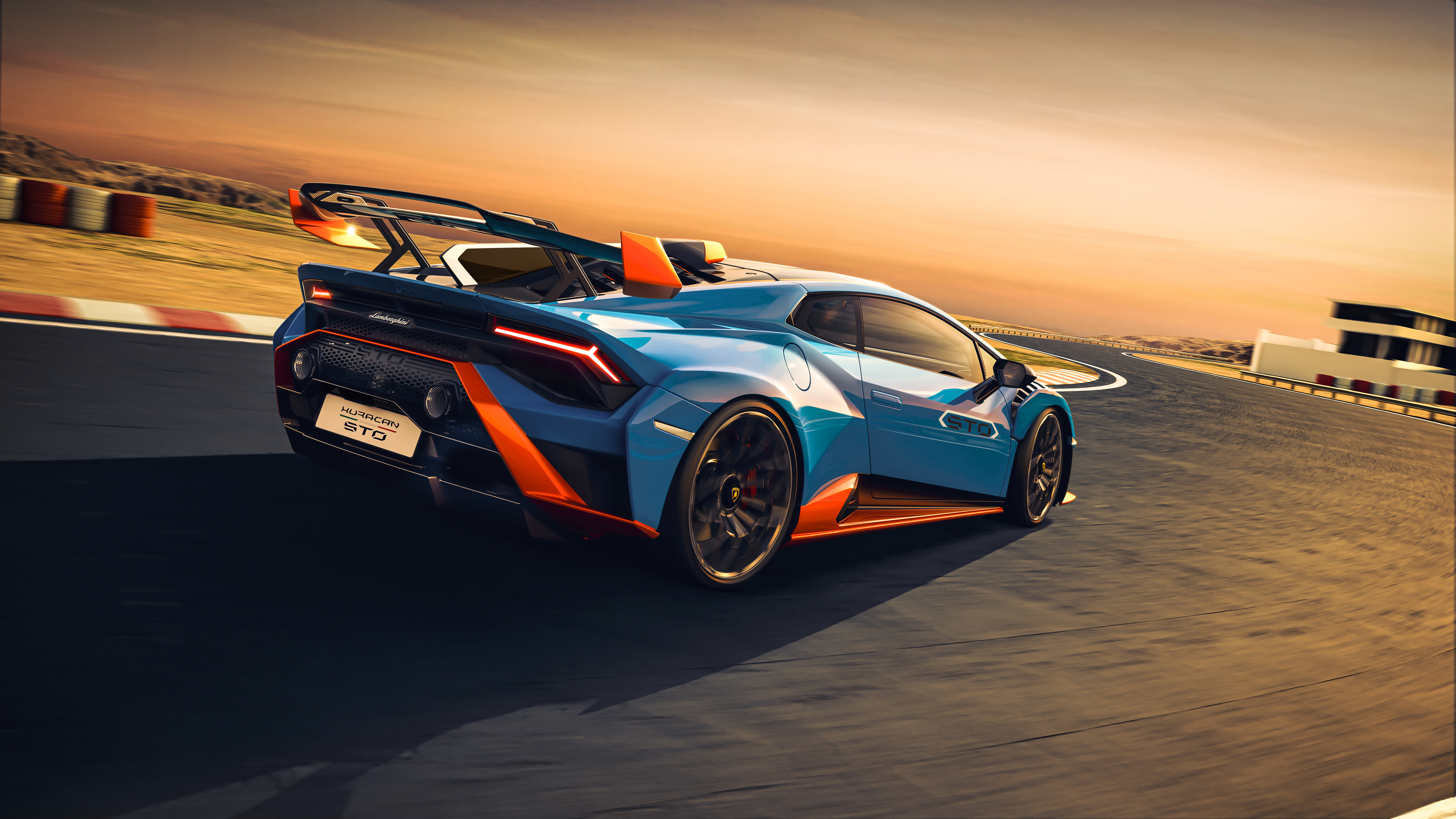 Blue Lamborghini Huracán STO on a race track HD Wallpaper