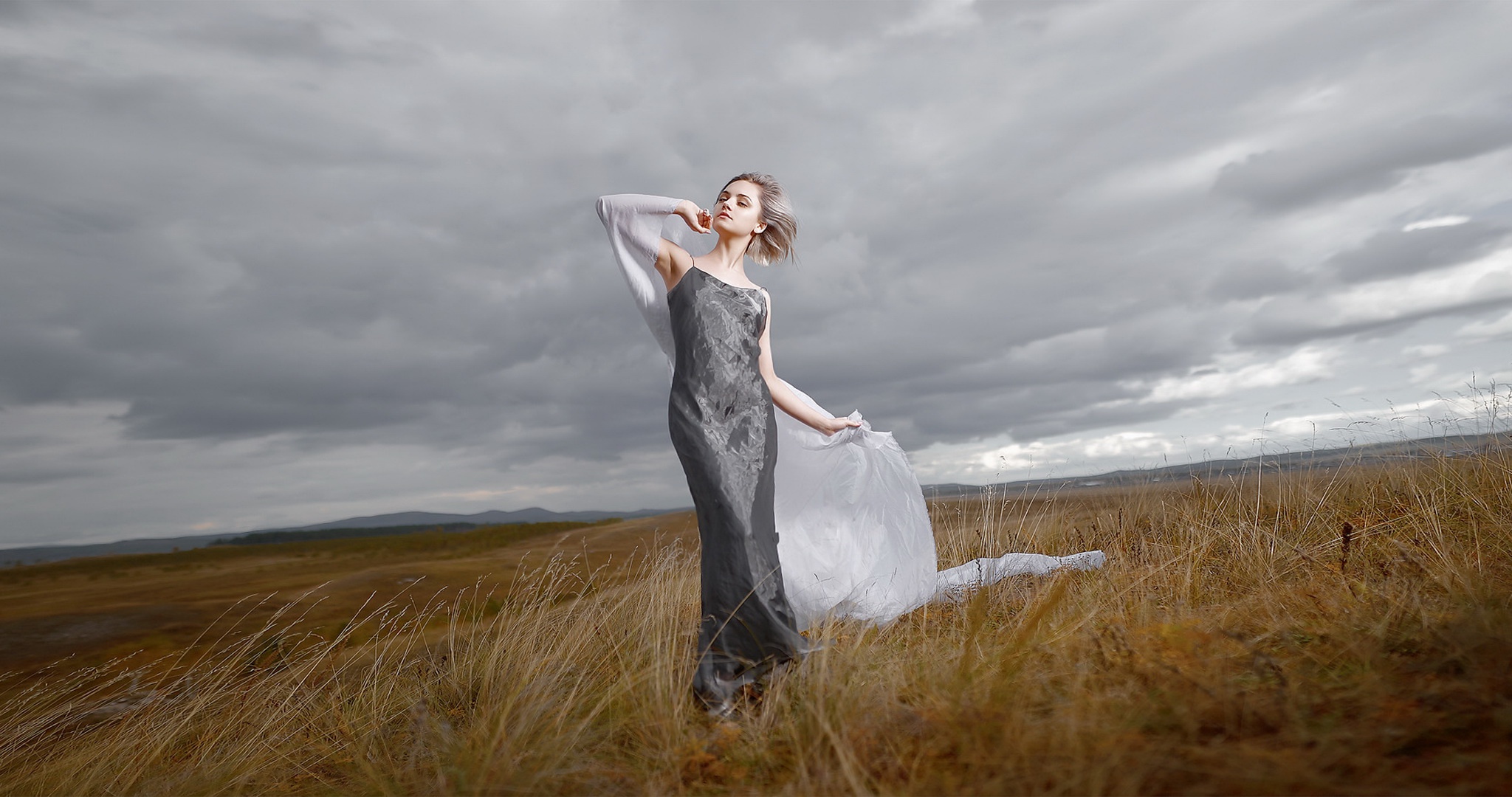 Elegant Model Posing Outdoors in Field HD Wallpaper