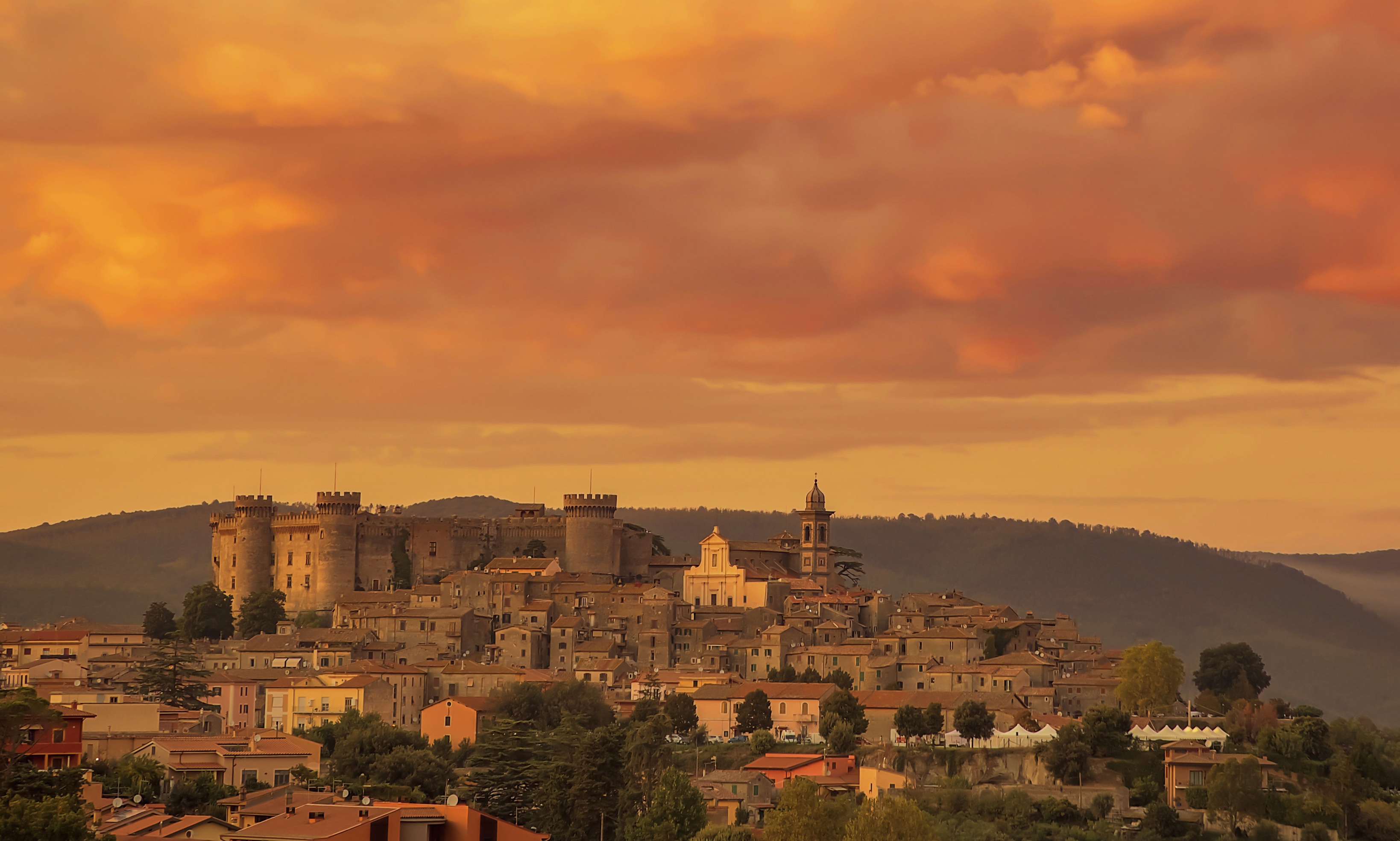 Castle and town in Bracciano, Italy at sunset HD Wallpaper