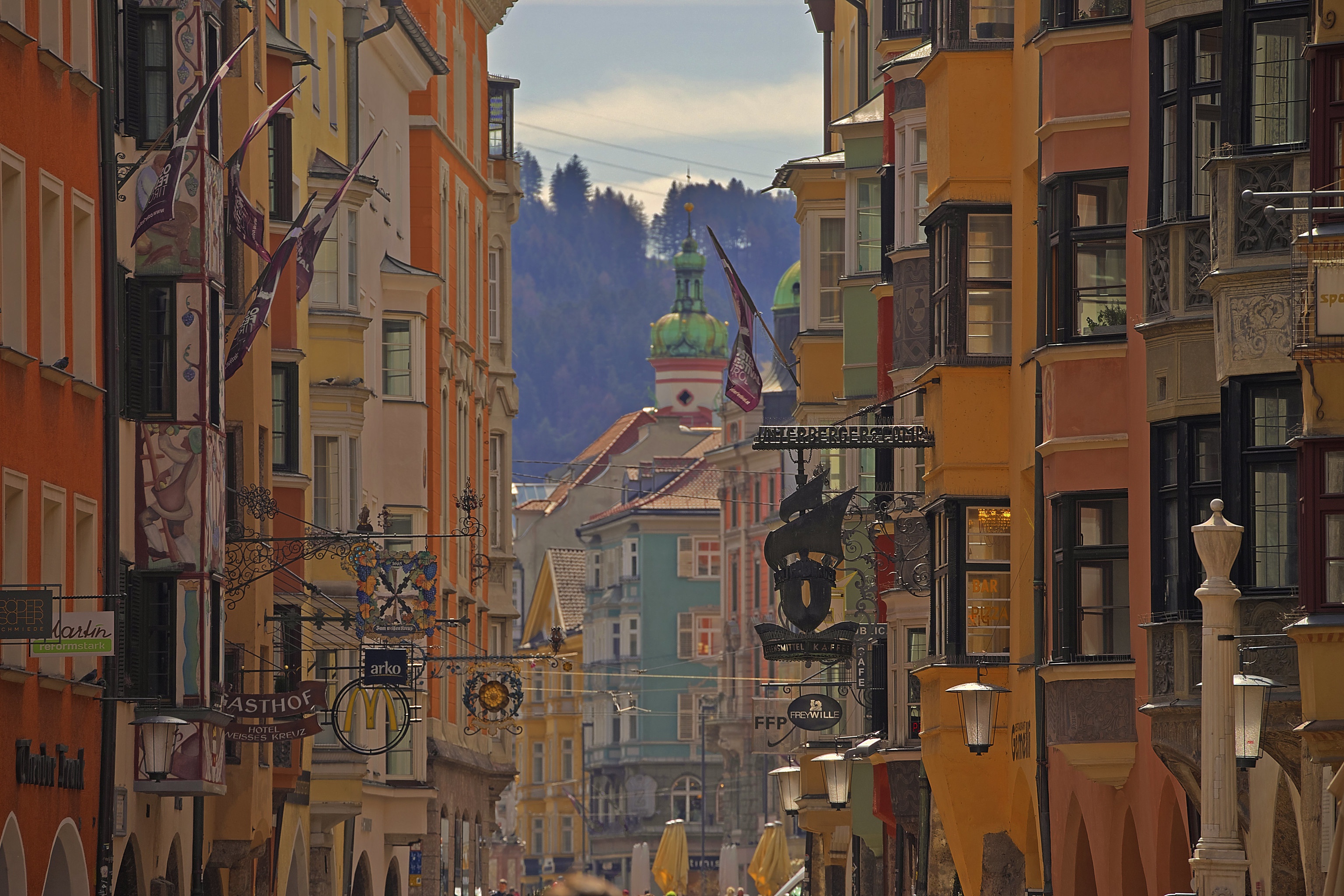 Colorful buildings on a street in Innsbruck, Austria HD Wallpaper