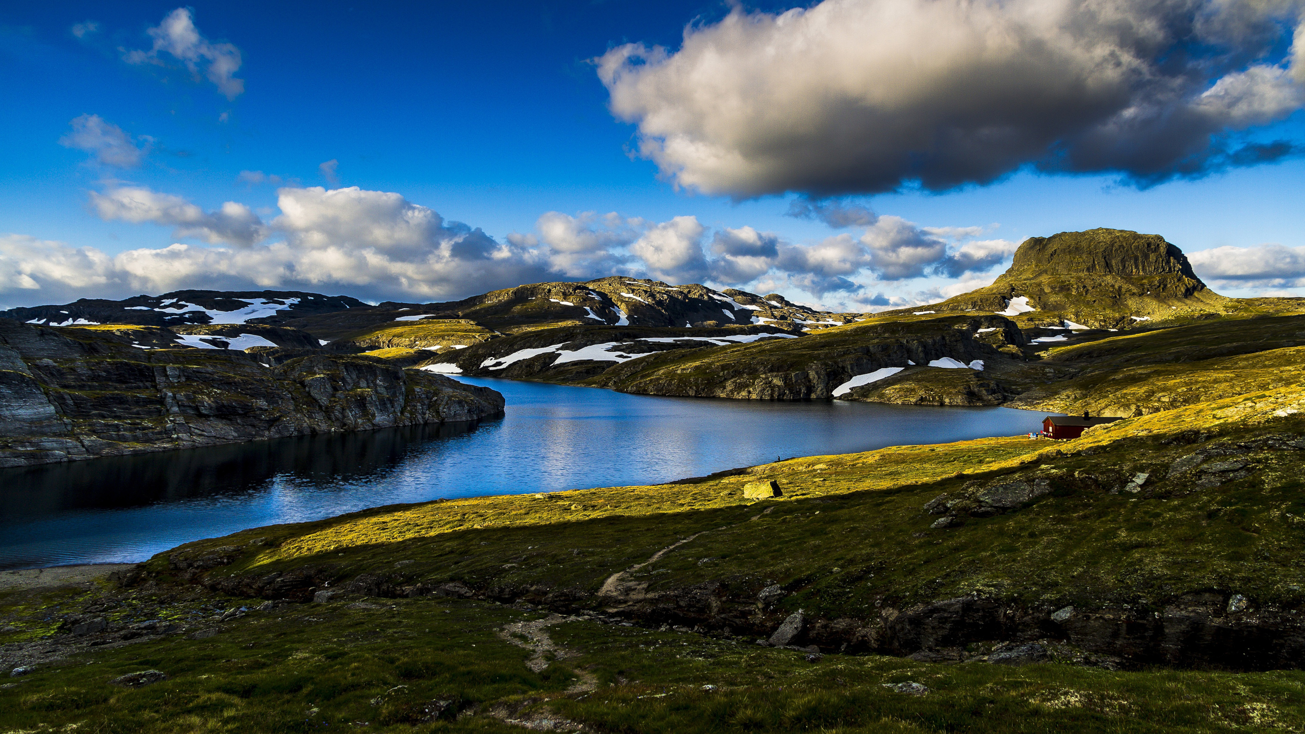 Lake and mountains in Norway with a red cabin HD Wallpaper