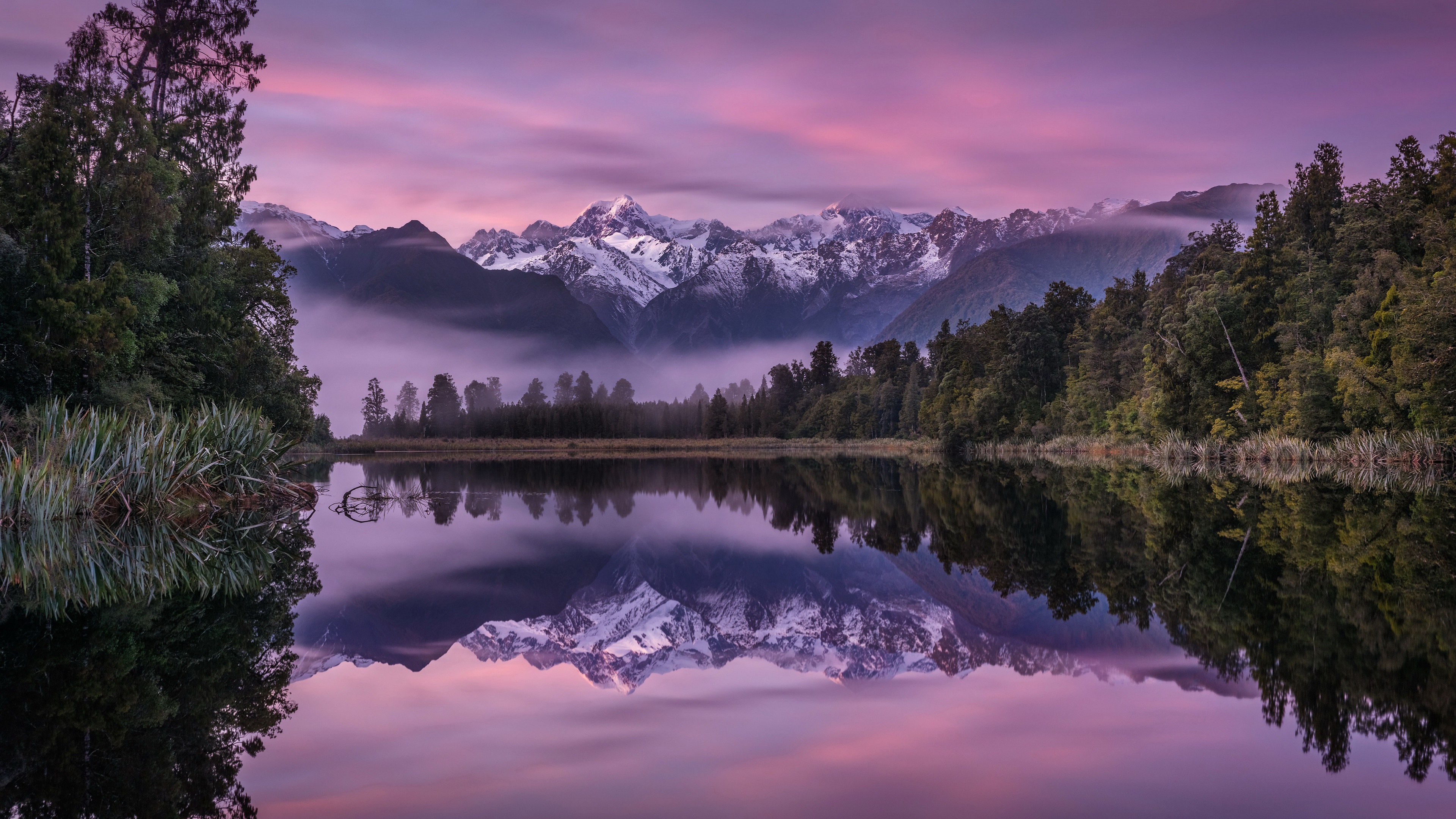 Lake reflection of snow-capped mountains at sunset HD Wallpaper