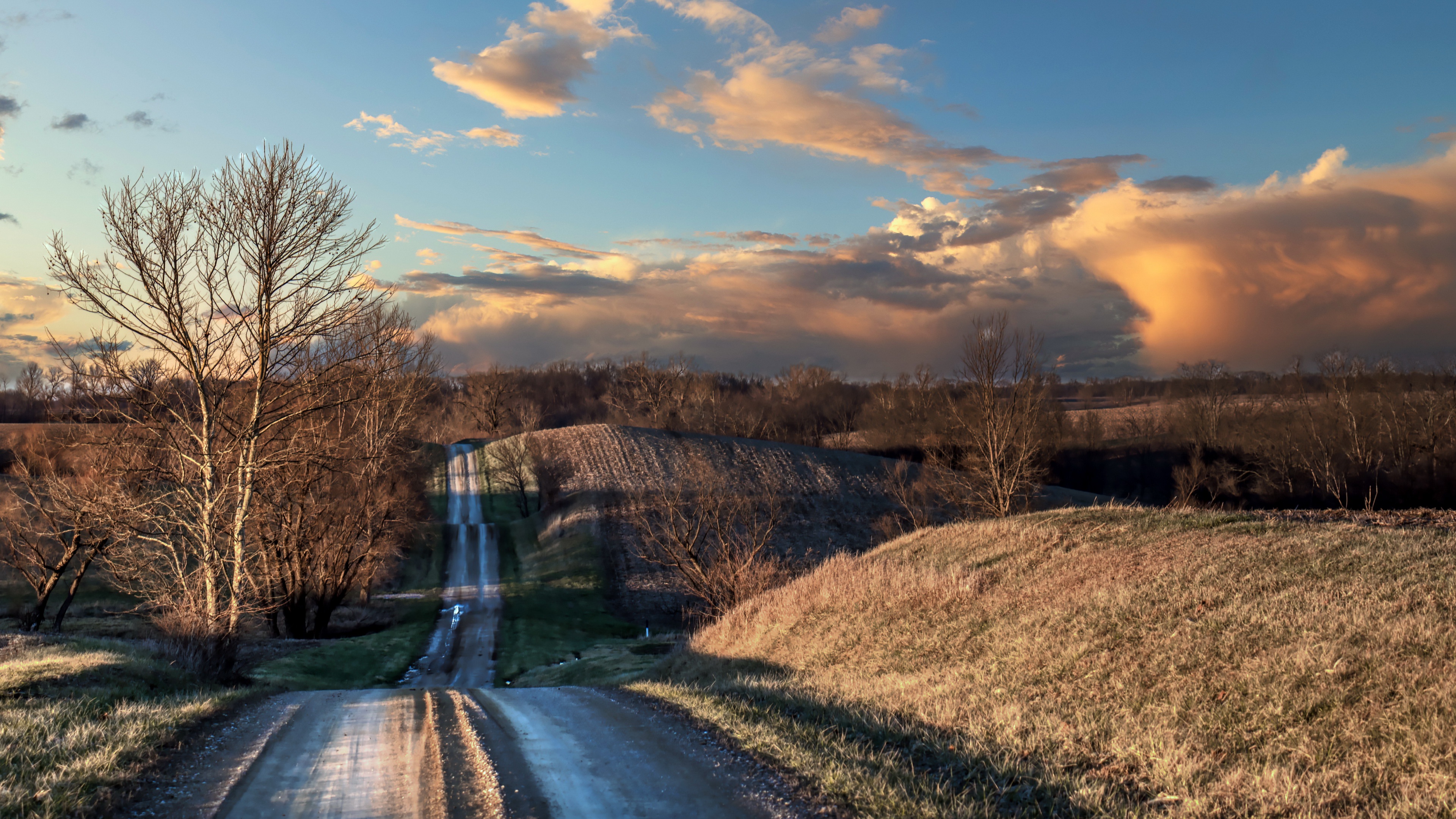 Dirt Road Through Rolling Hills at Sunset HD Wallpaper