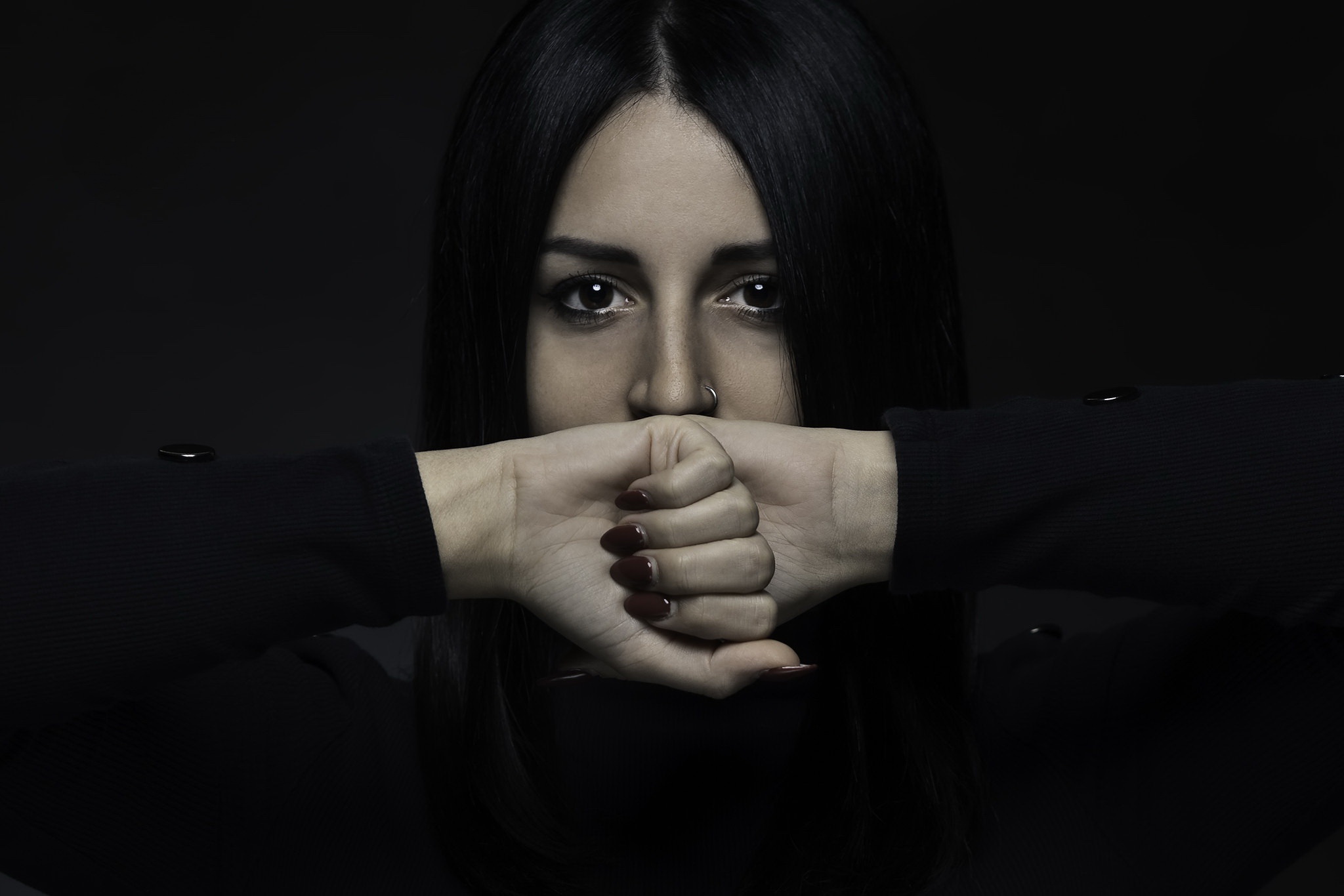 Woman covering mouth with hands HD Wallpaper