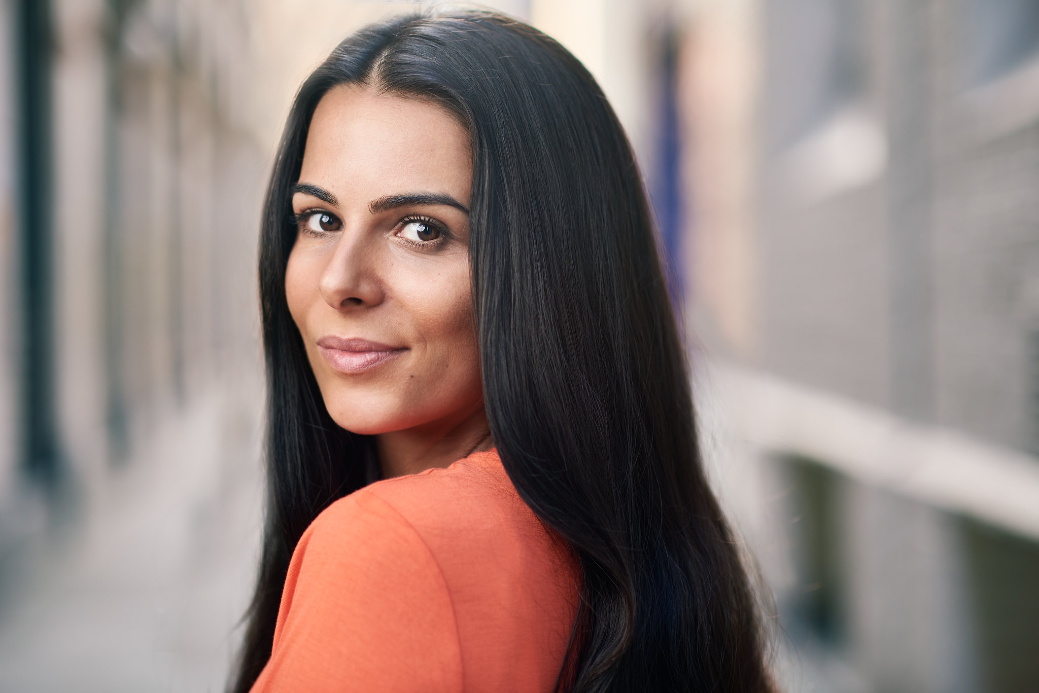 Woman with long black hair smiling HD Wallpaper