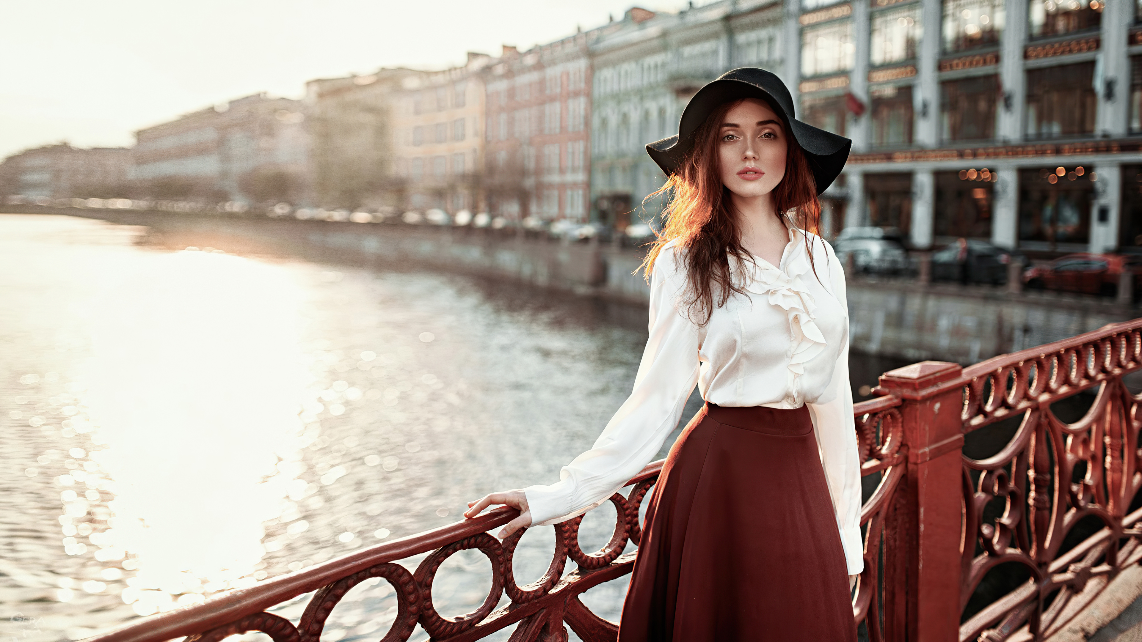Woman in hat and white blouse by river HD Wallpaper