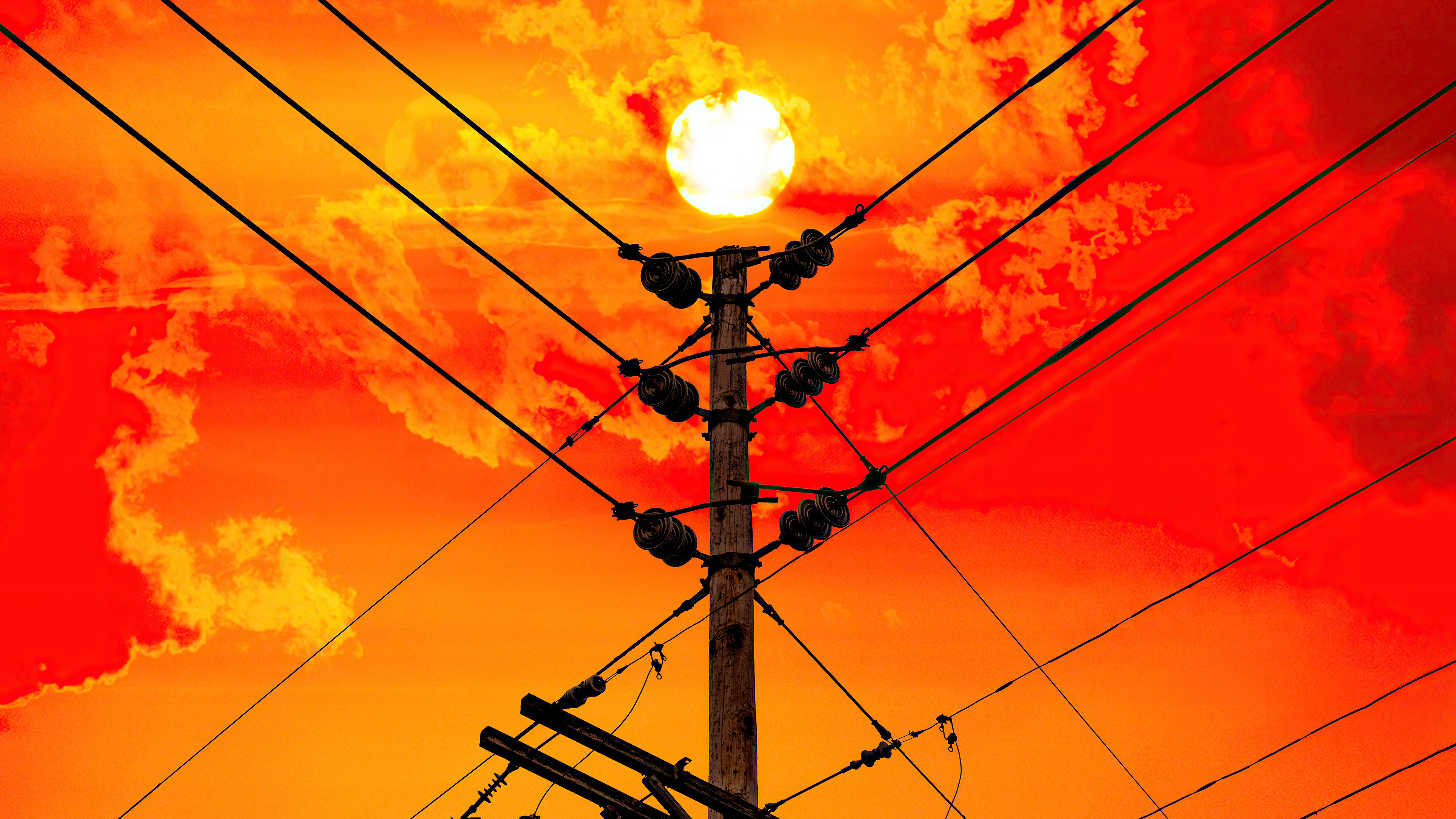 Sun behind power lines and clouds HD Wallpaper