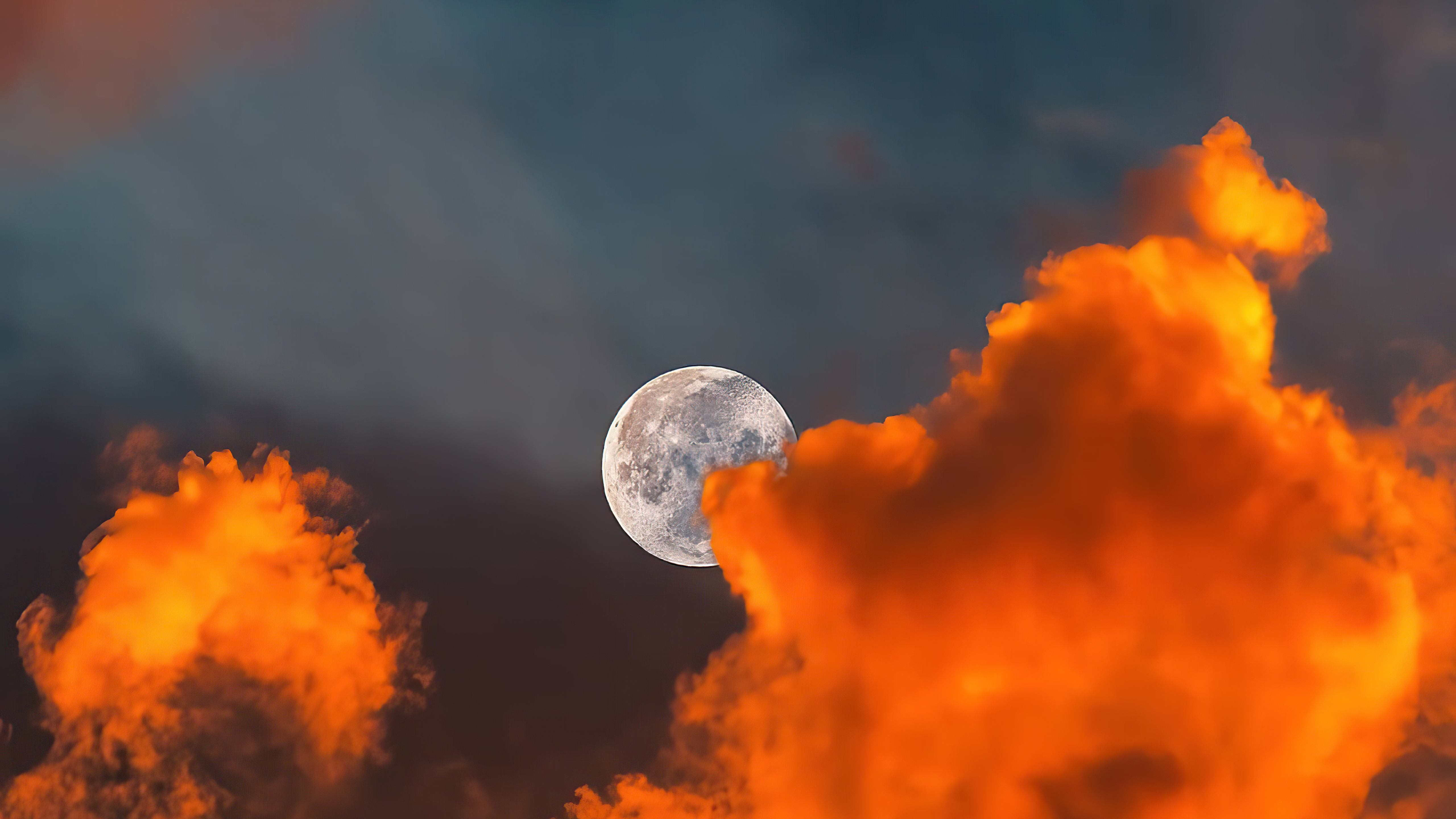 Full moon behind orange clouds HD Wallpaper