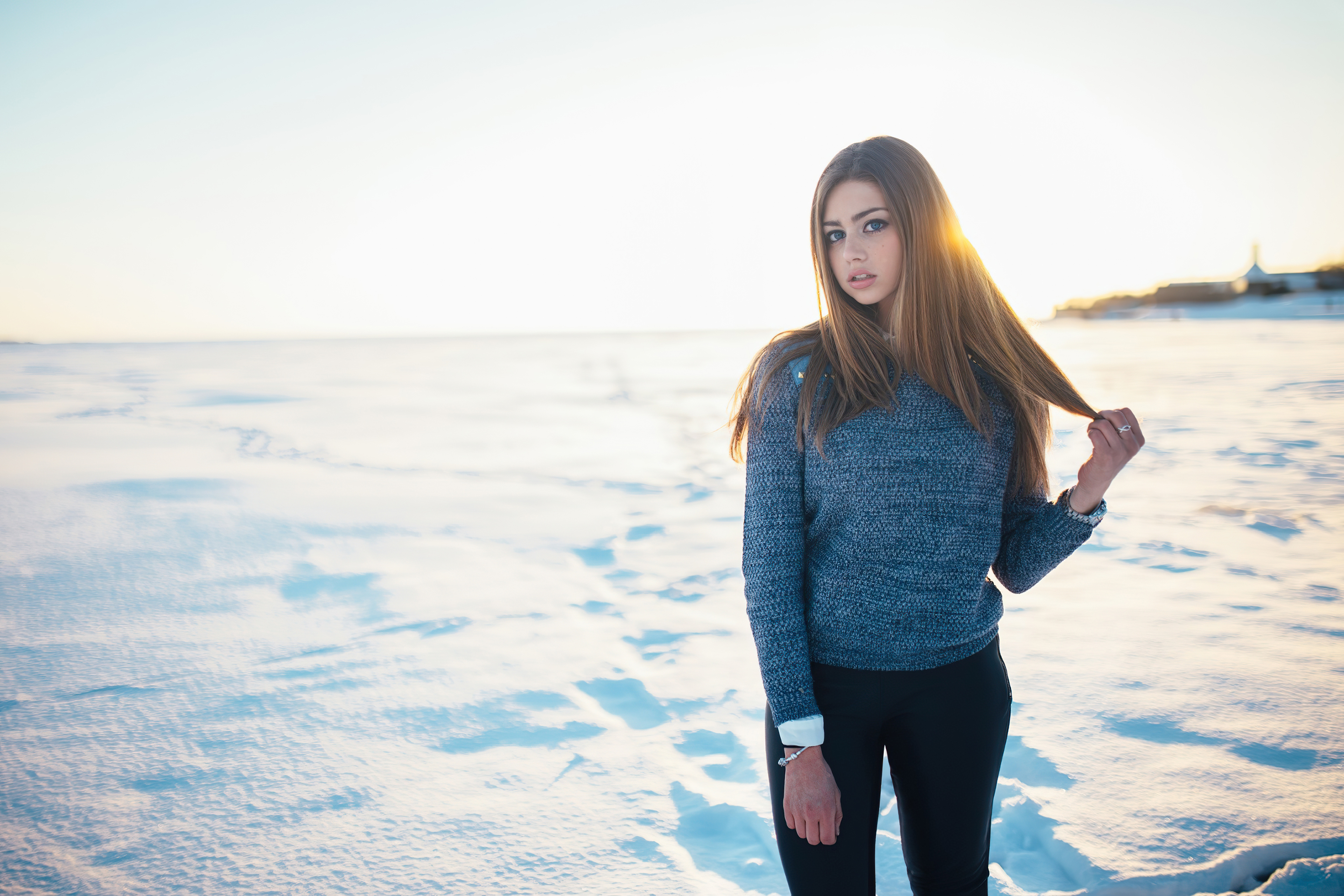Girl in a sweater in a snowy field HD Wallpaper