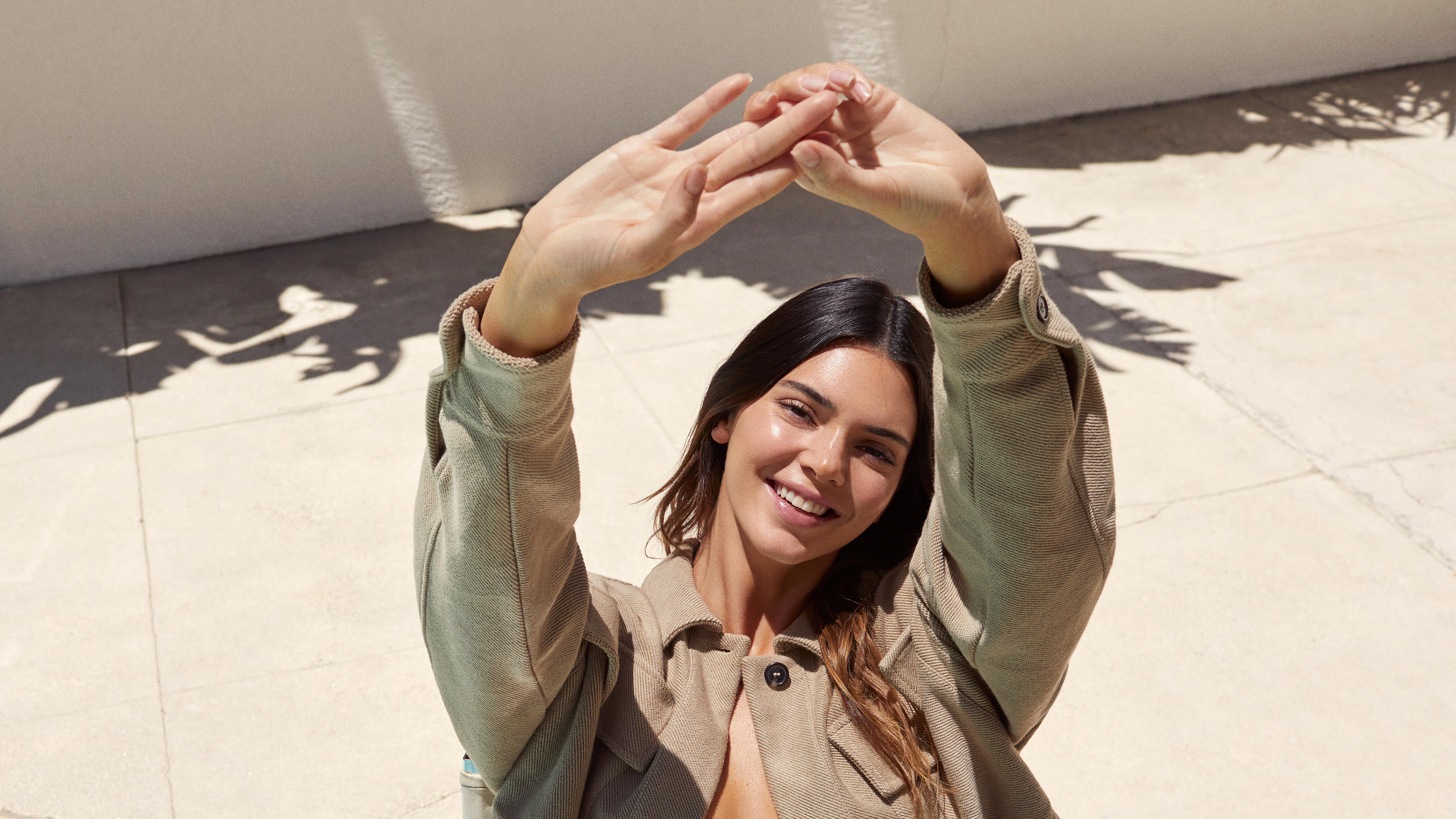 Kendall Jenner posing with hands above head HD Wallpaper