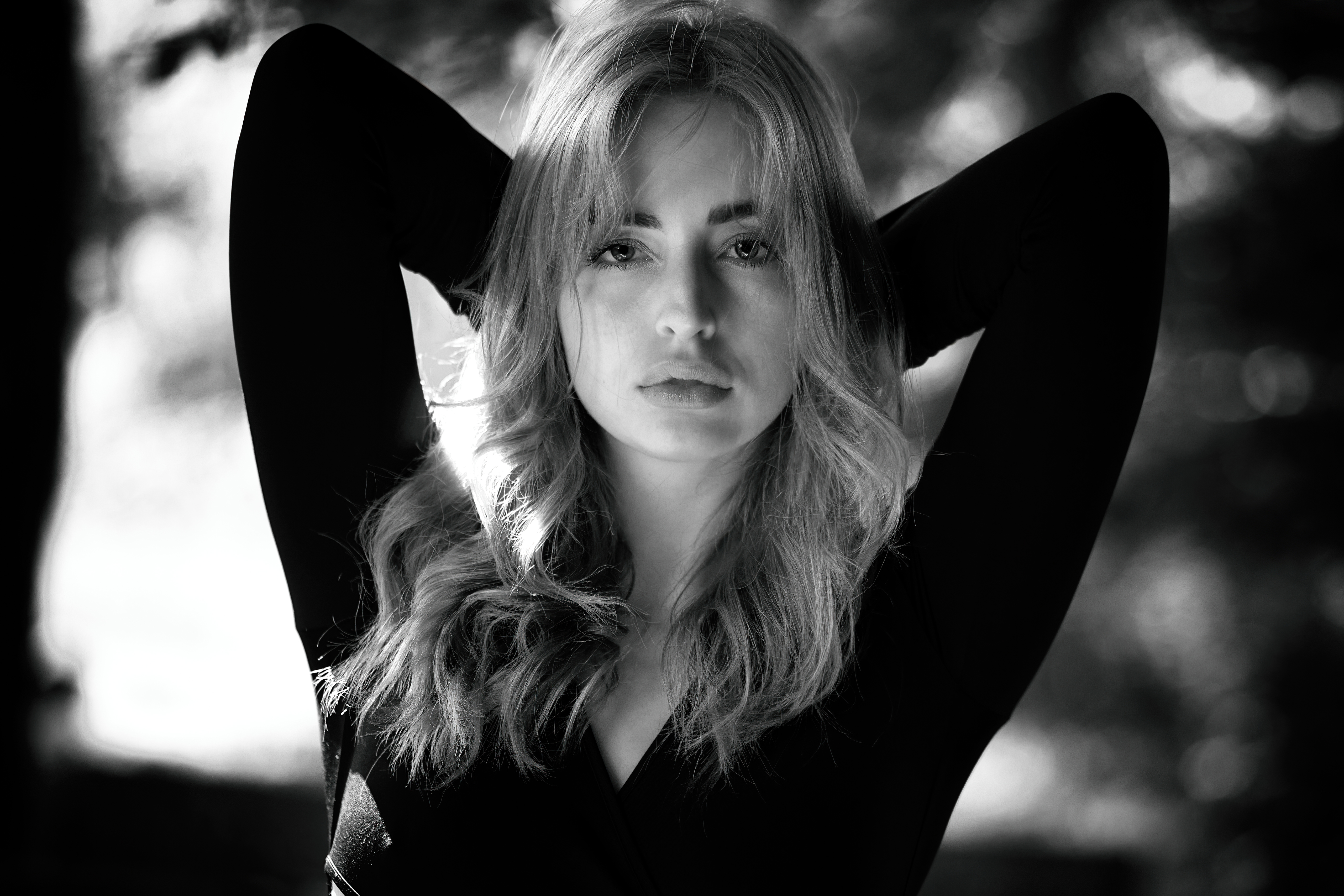 Monochrome portrait of a young woman in a black dress HD Wallpaper