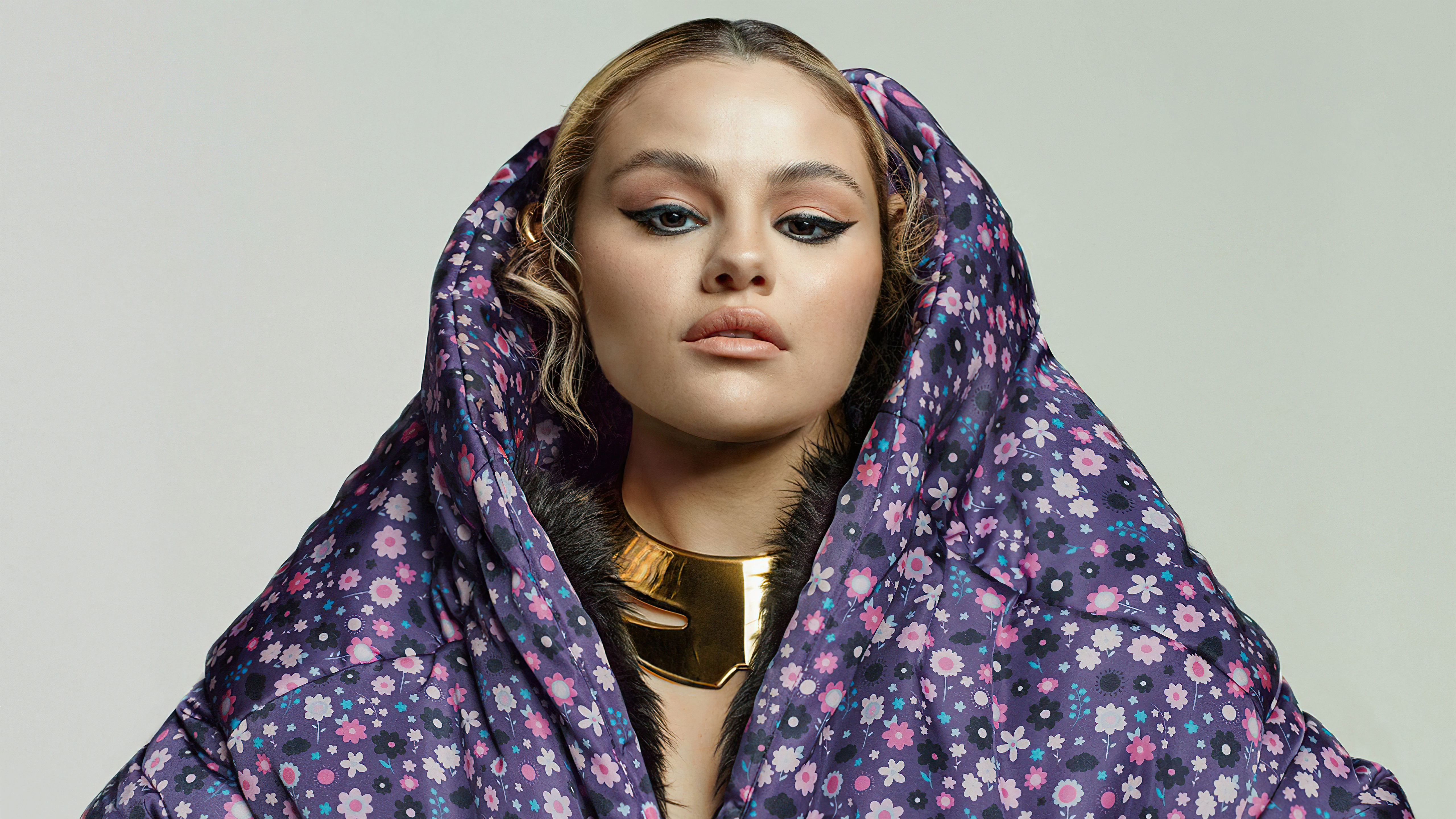 Selena Gomez in a floral puffer jacket and gold necklace HD Wallpaper