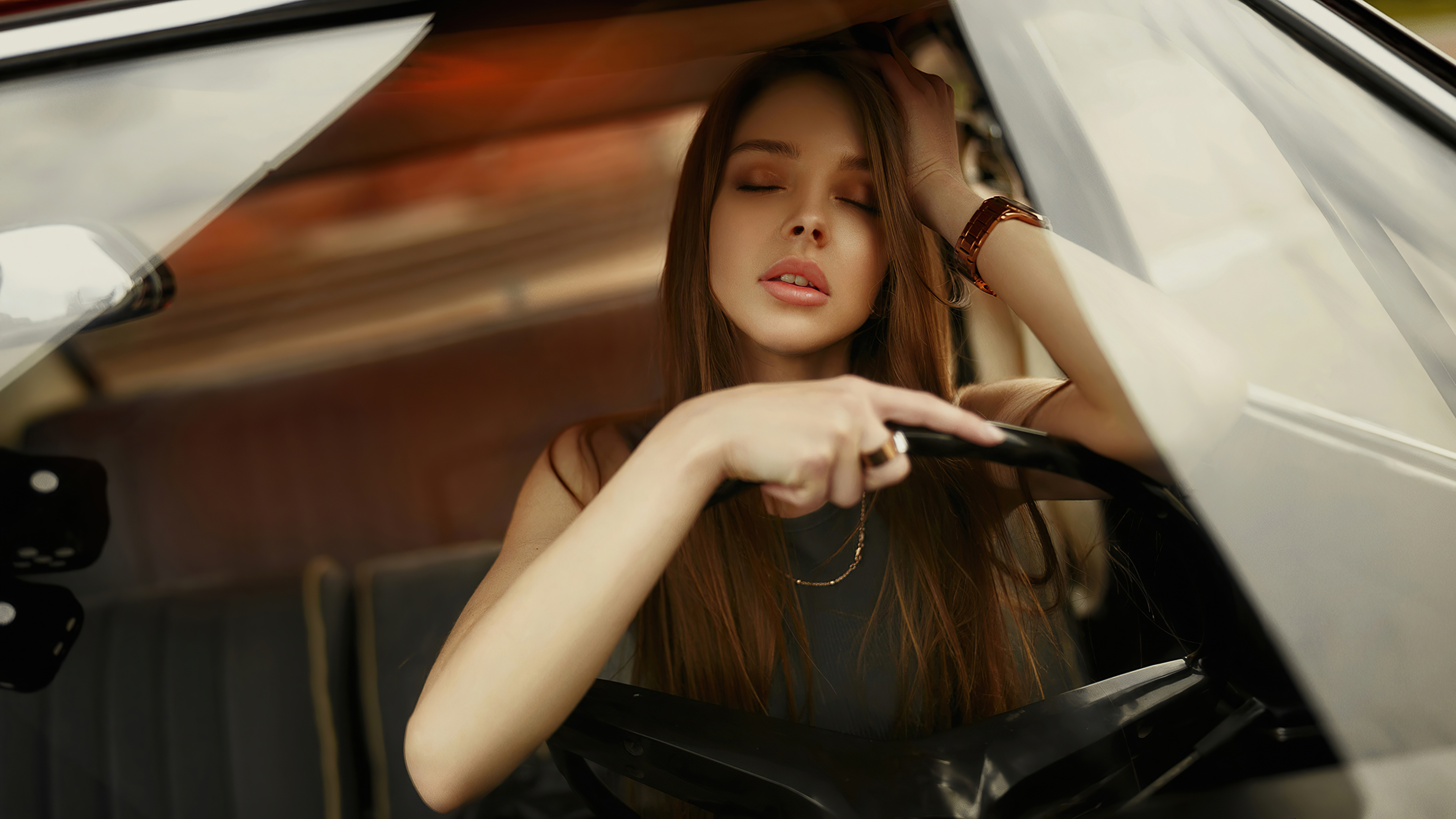 Model in a car with dice HD Wallpaper