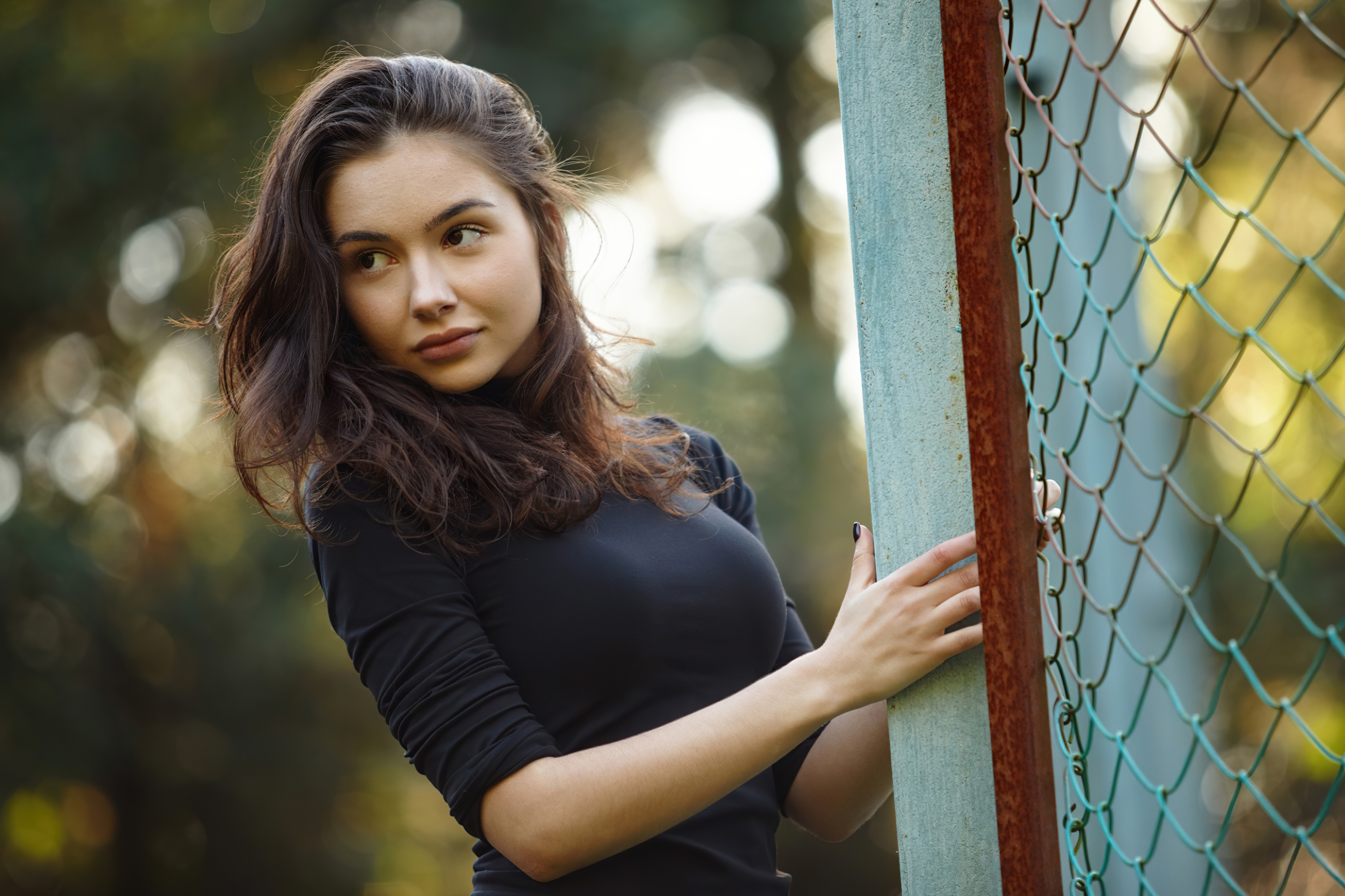 Girl in black dress near fence HD Wallpaper