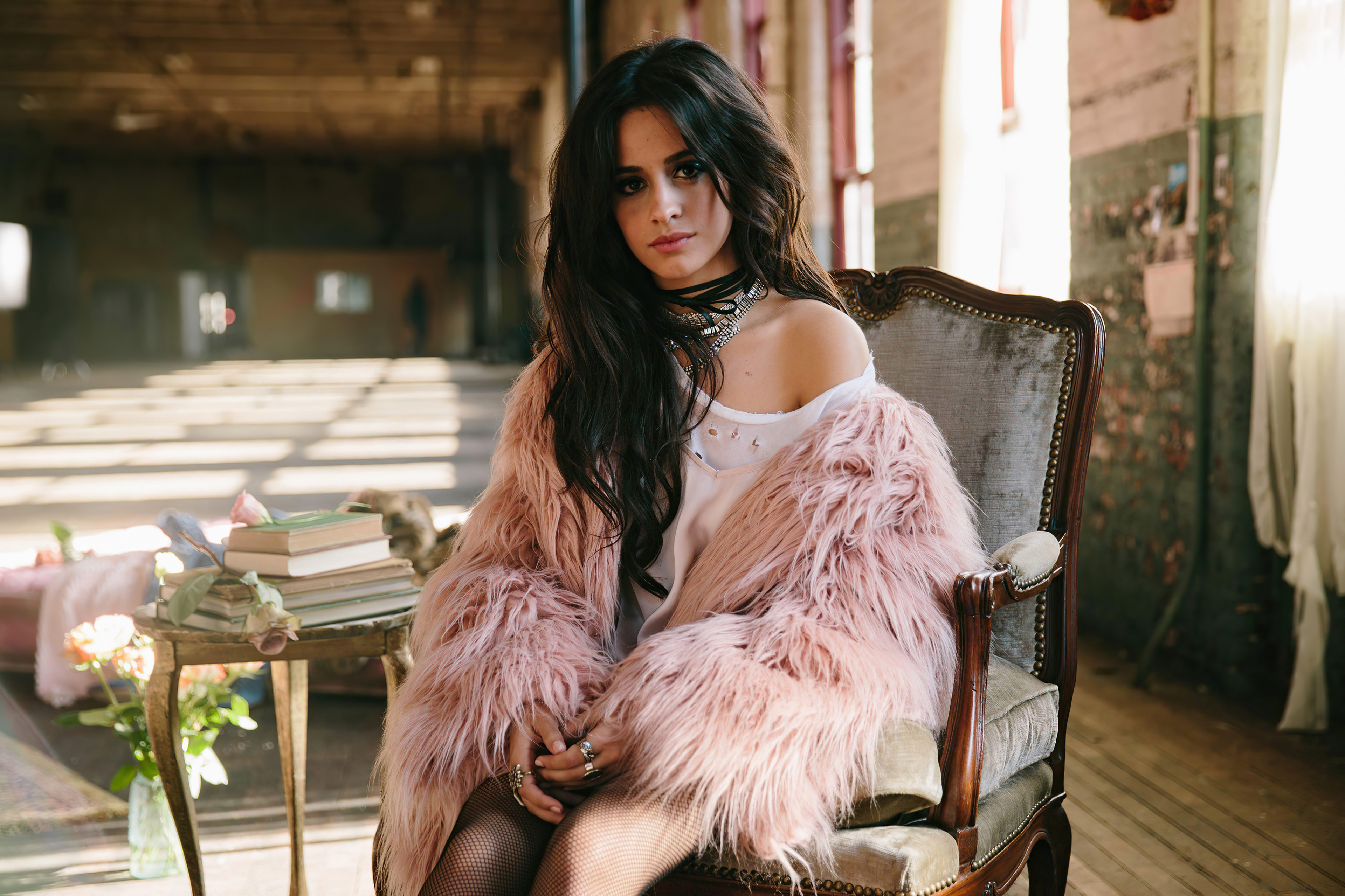 Camila Cabello sitting in a chair HD Wallpaper