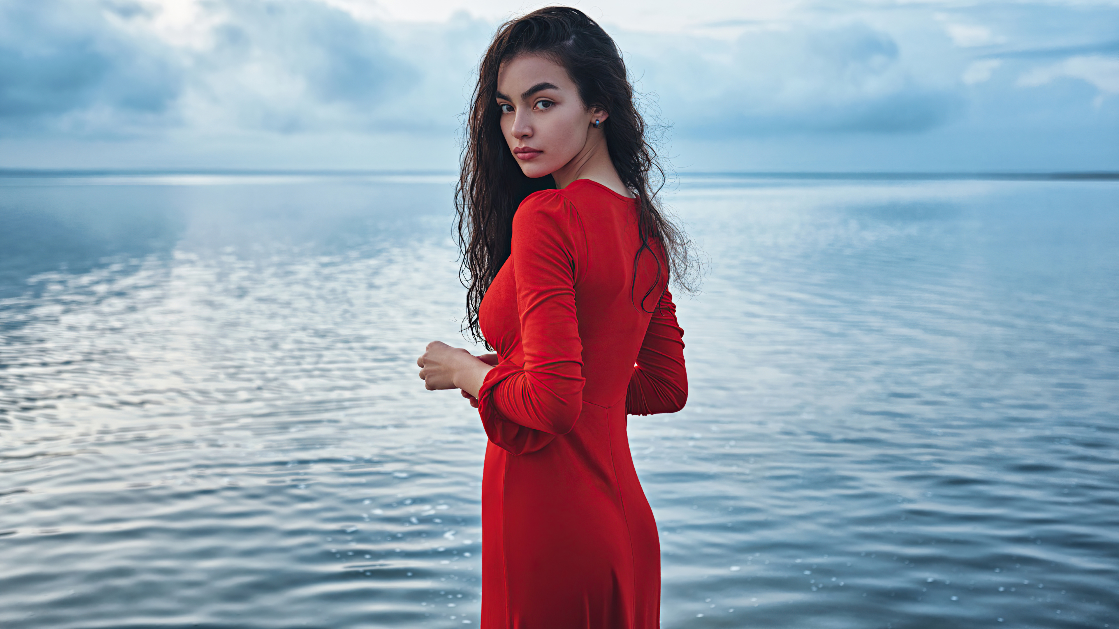 Woman in red dress by the water 4K HD Wallpaper
