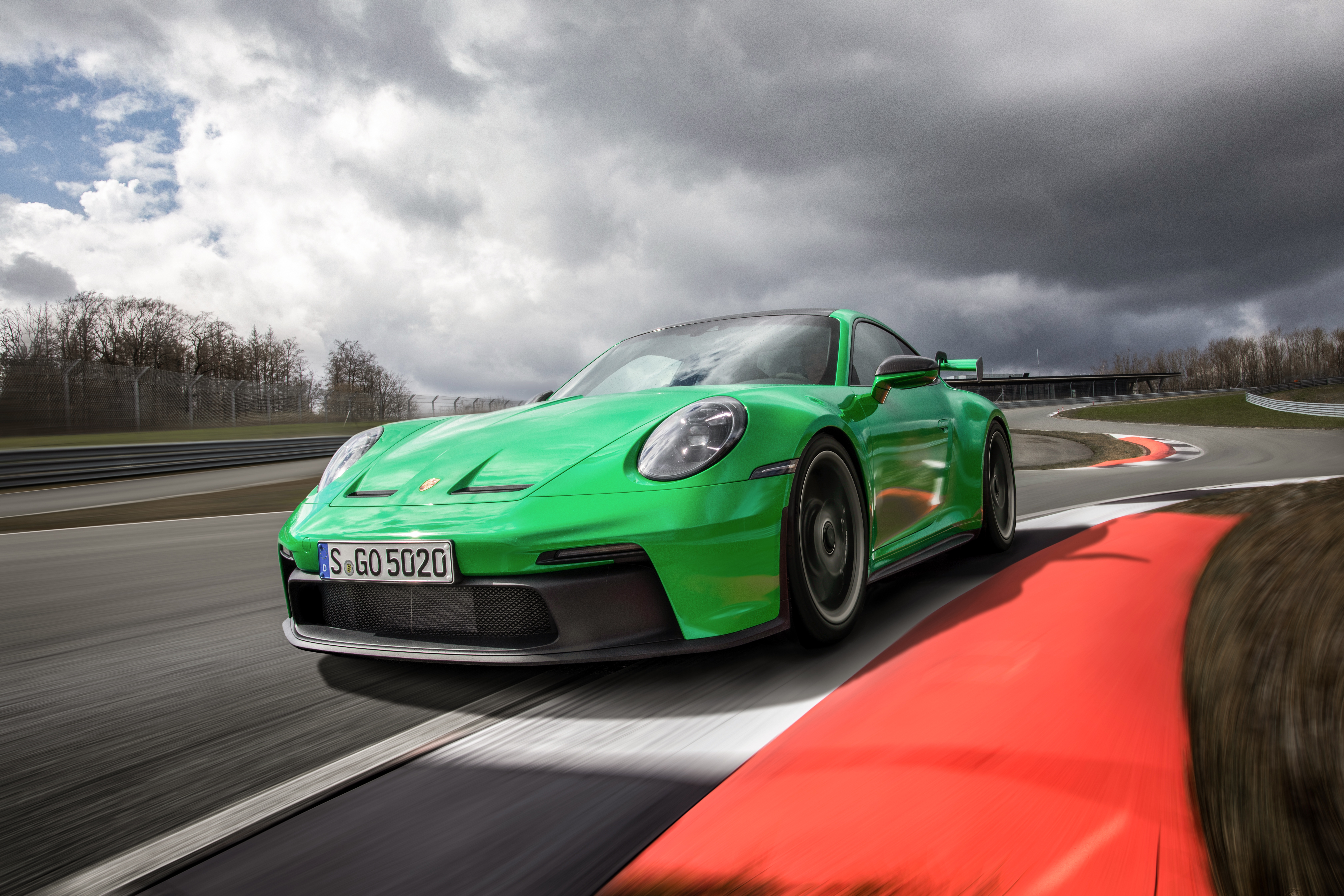 Green Porsche 911 GT3 R on a race track HD Wallpaper