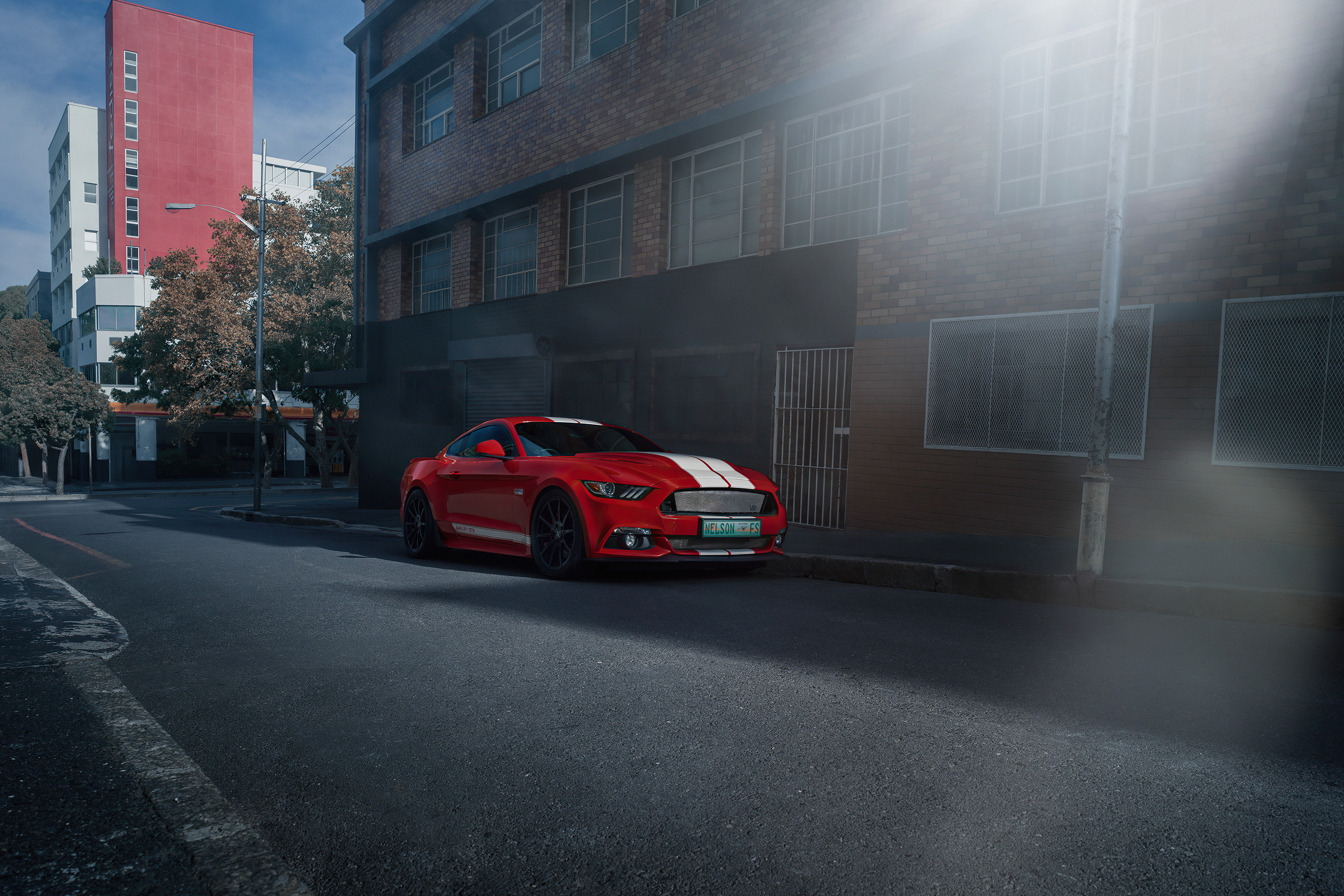 Red Ford Mustang with White Stripes on Street HD Wallpaper