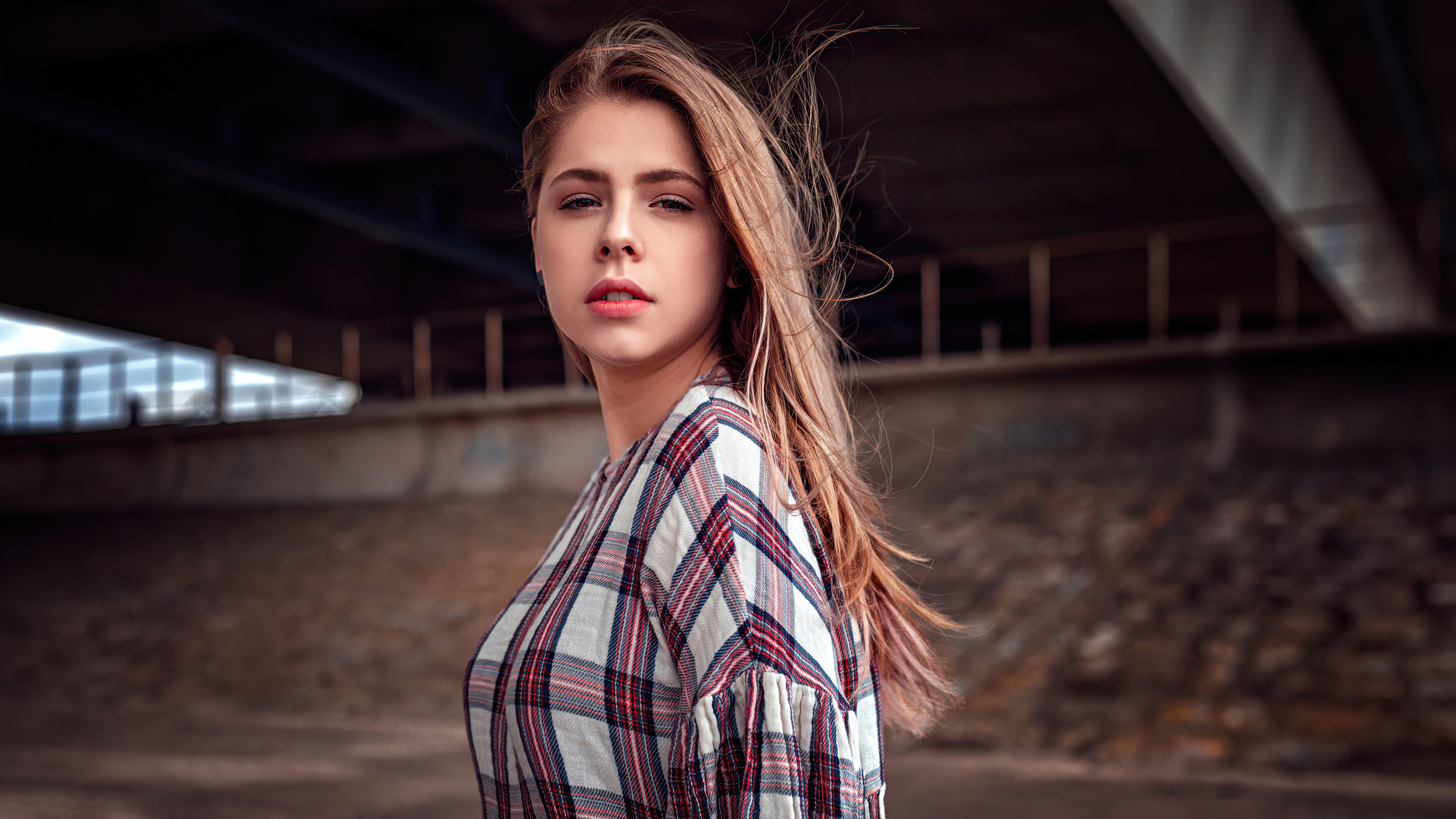Model in plaid shirt under bridge HD Wallpaper
