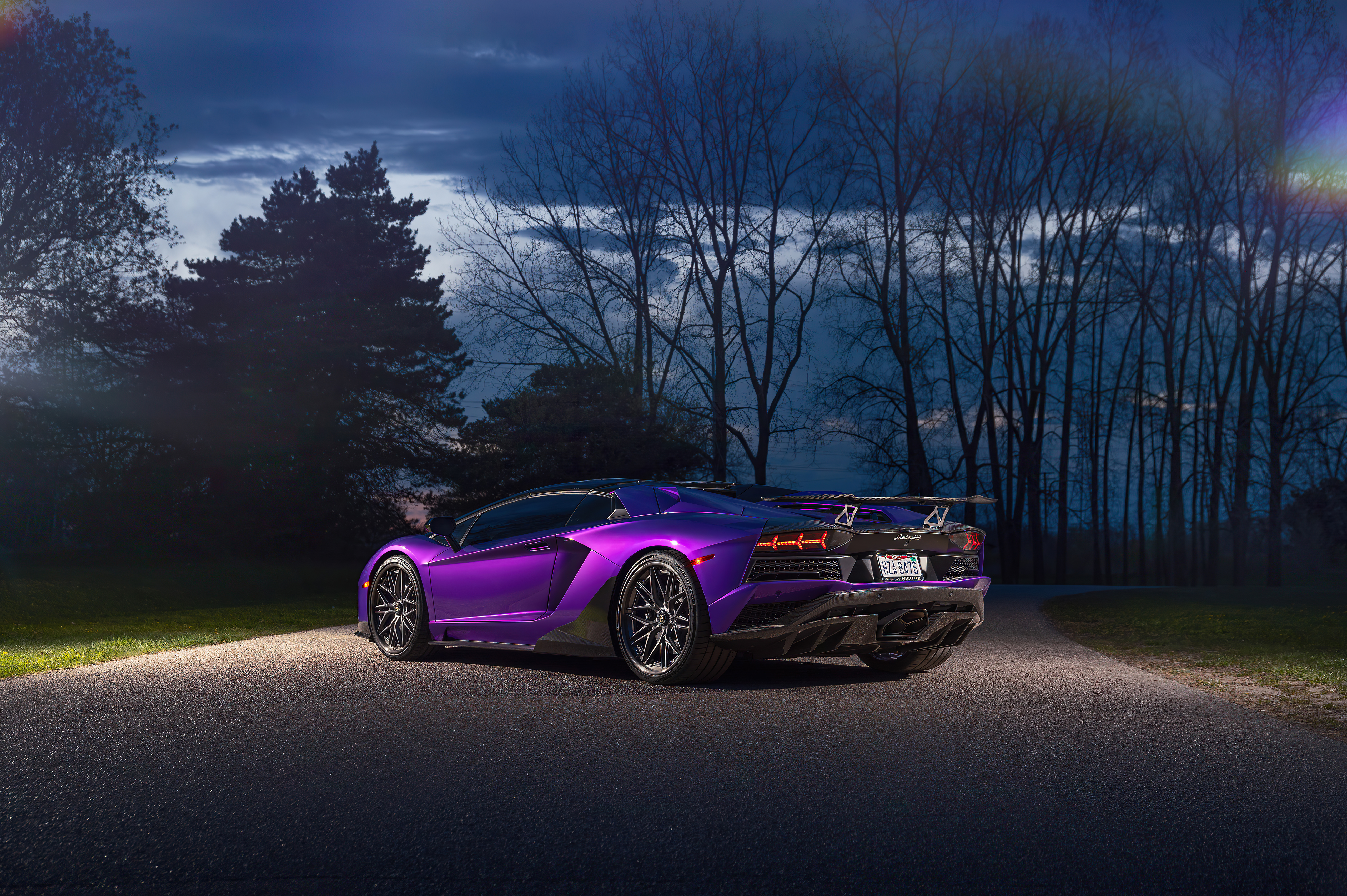 Purple Lamborghini Aventador parked on a road at dusk HD Wallpaper