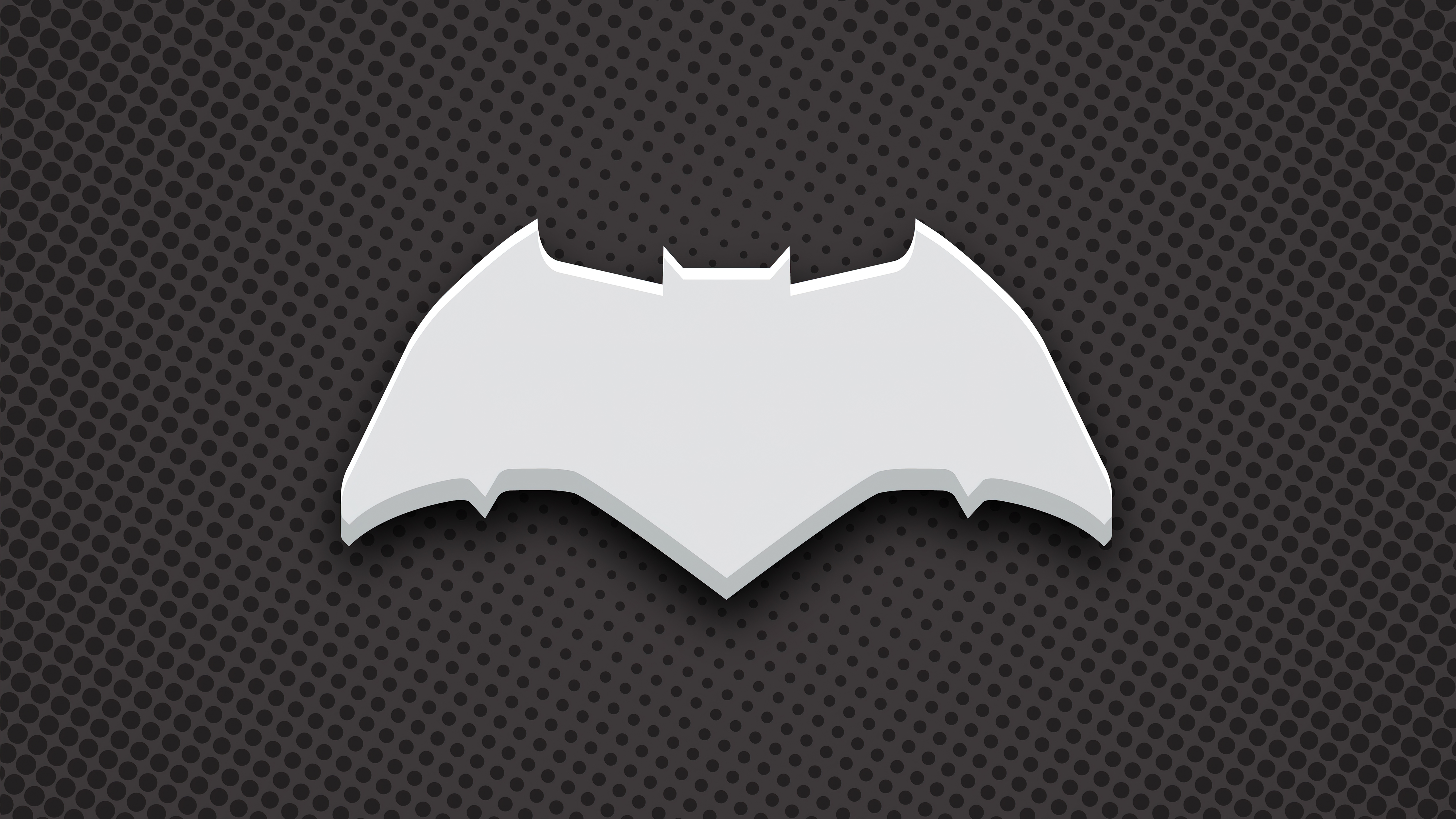 Batman logo on a dark dotted background HD Wallpaper