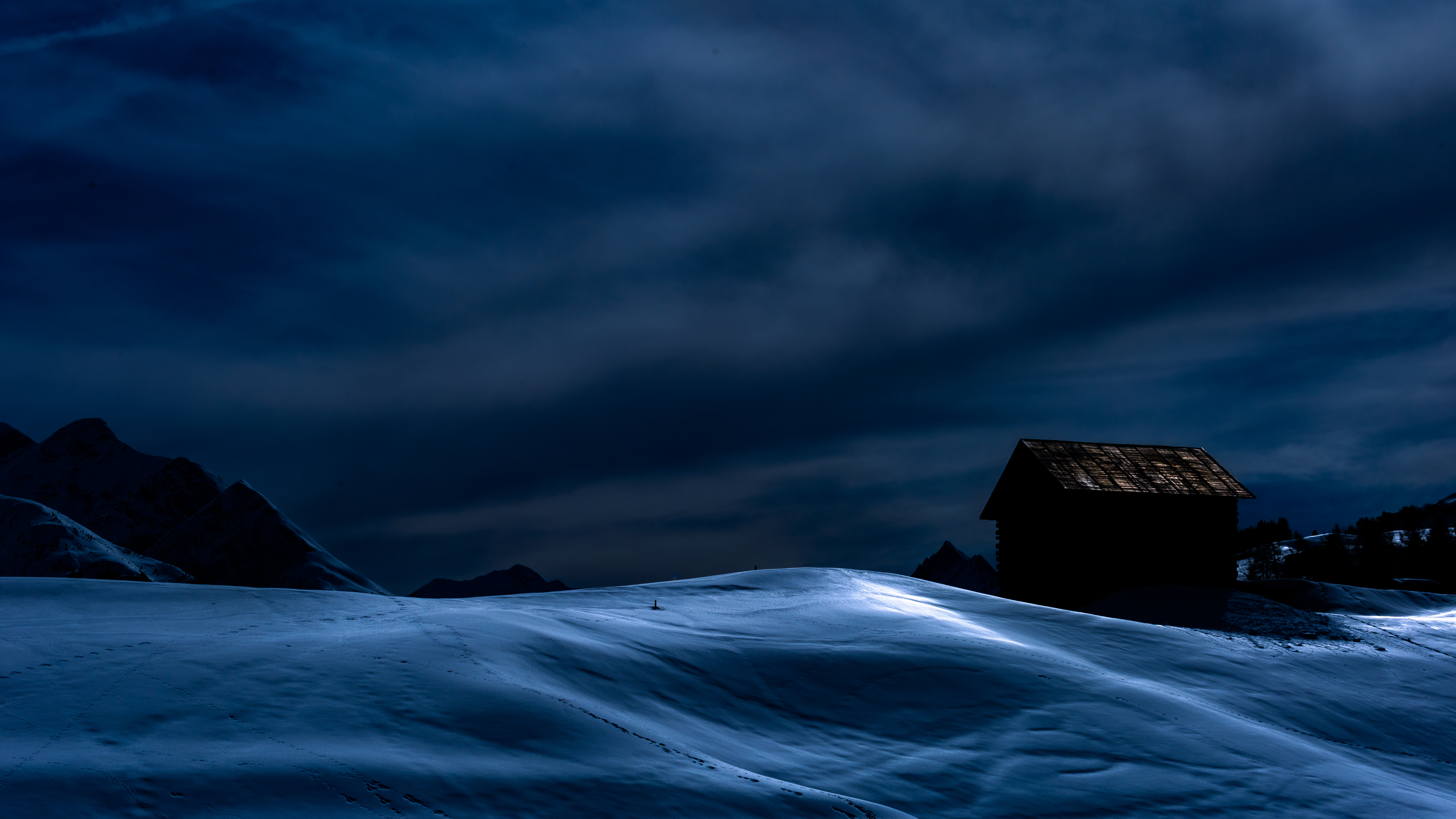 Snowy landscape with a cabin at dusk HD Wallpaper
