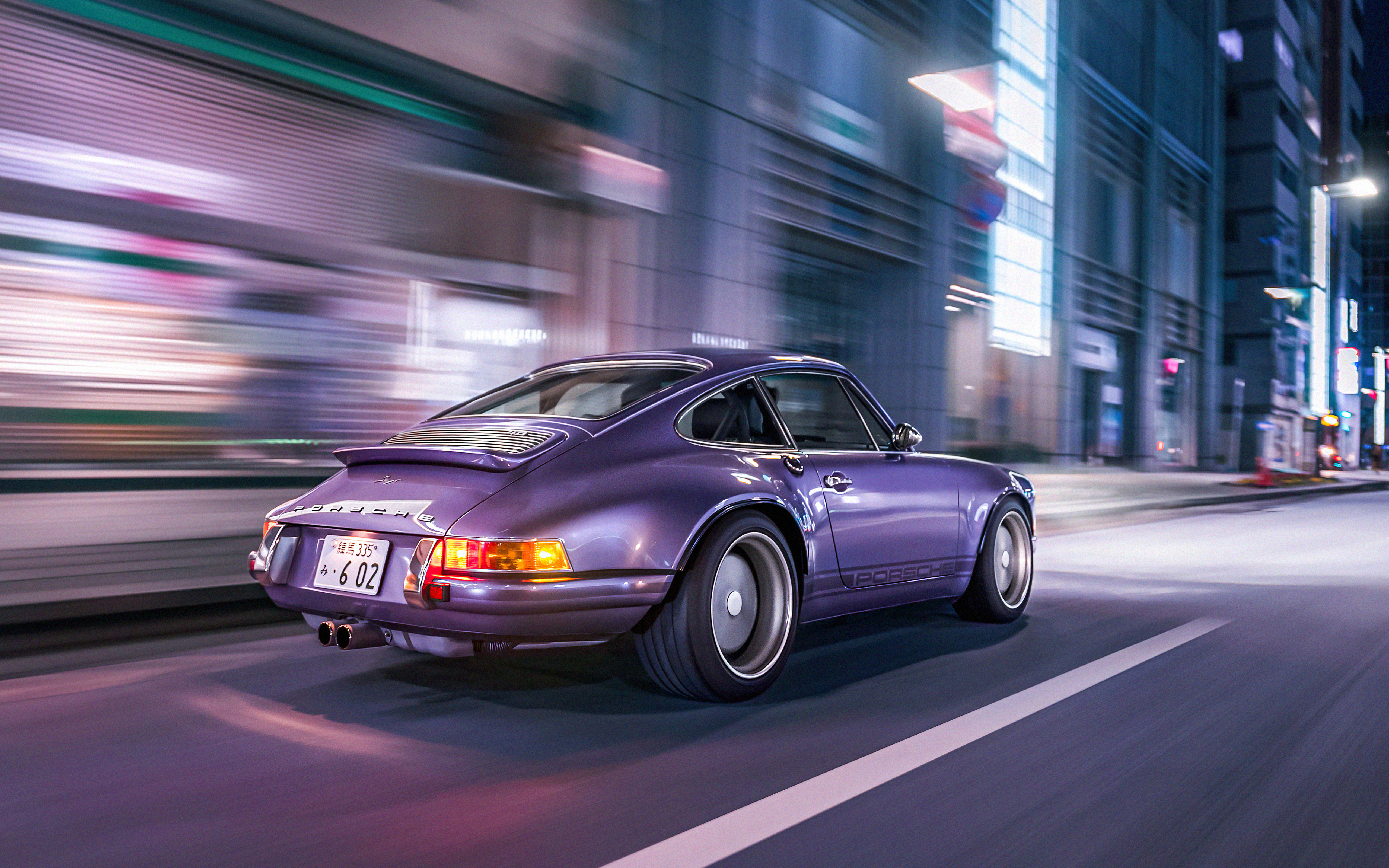 Purple Porsche 911 driving through city at night HD Wallpaper