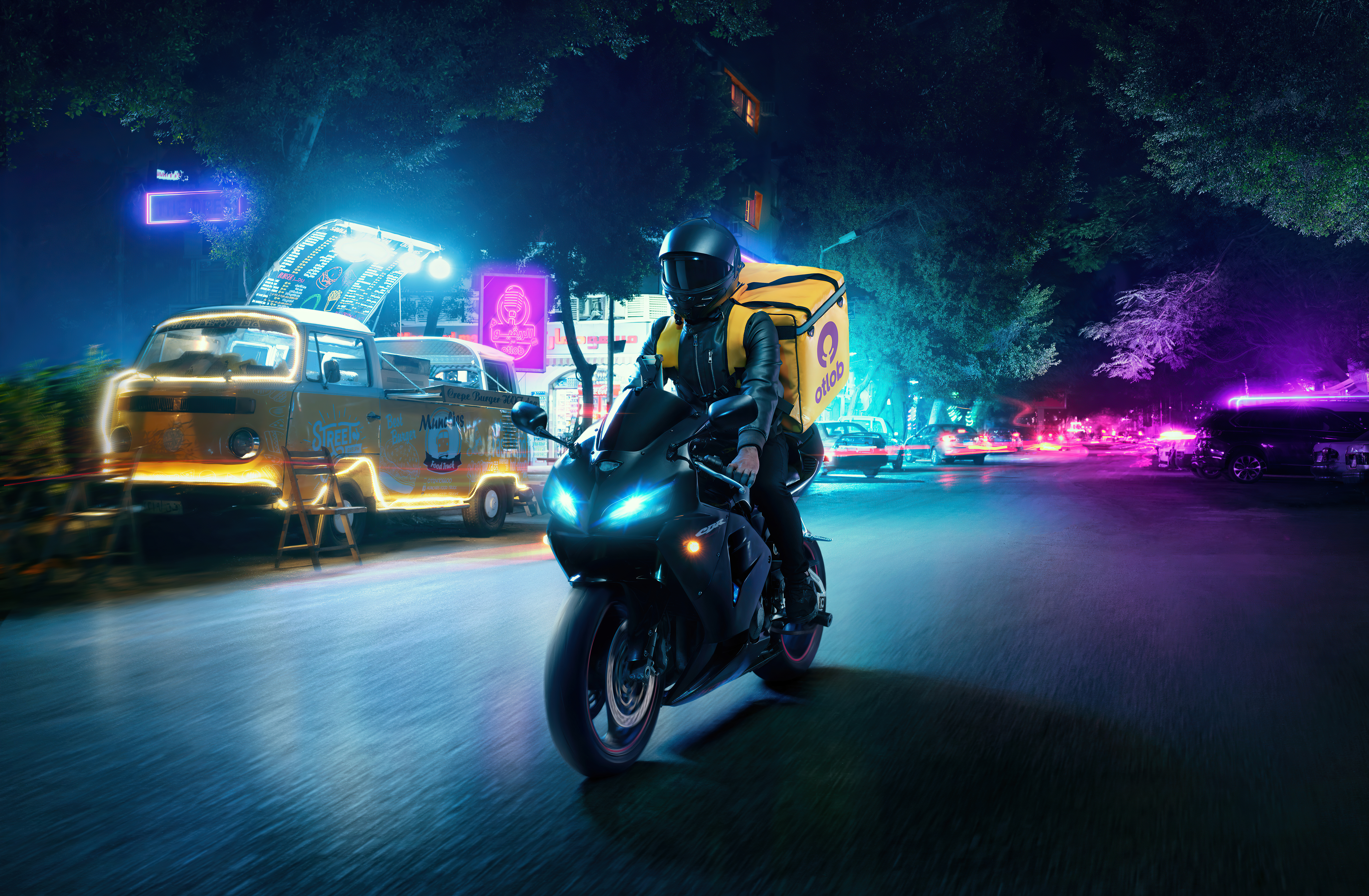 Delivery person on a motorcycle at night HD Wallpaper